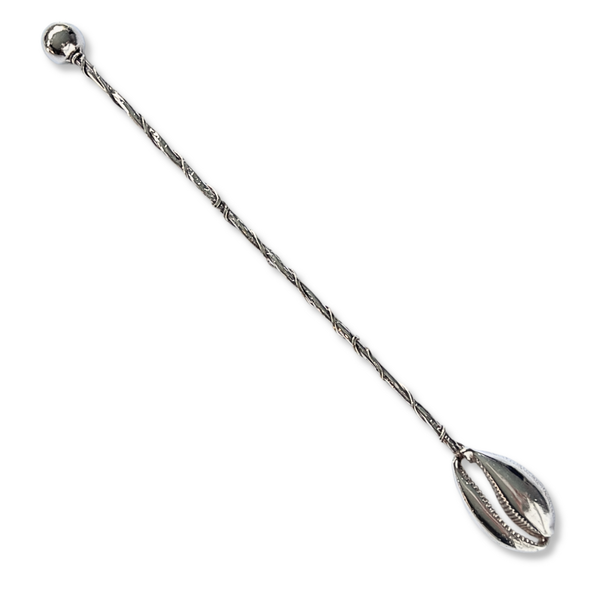 The Silver Cowrie Cocktail Stirrer by JAREDJAMIN Barware and More is a long, twisted silver-plated spoon featuring a small round ball at one end and an oval-shaped muddler with shell-like perforations for an elegant cocktail experience.