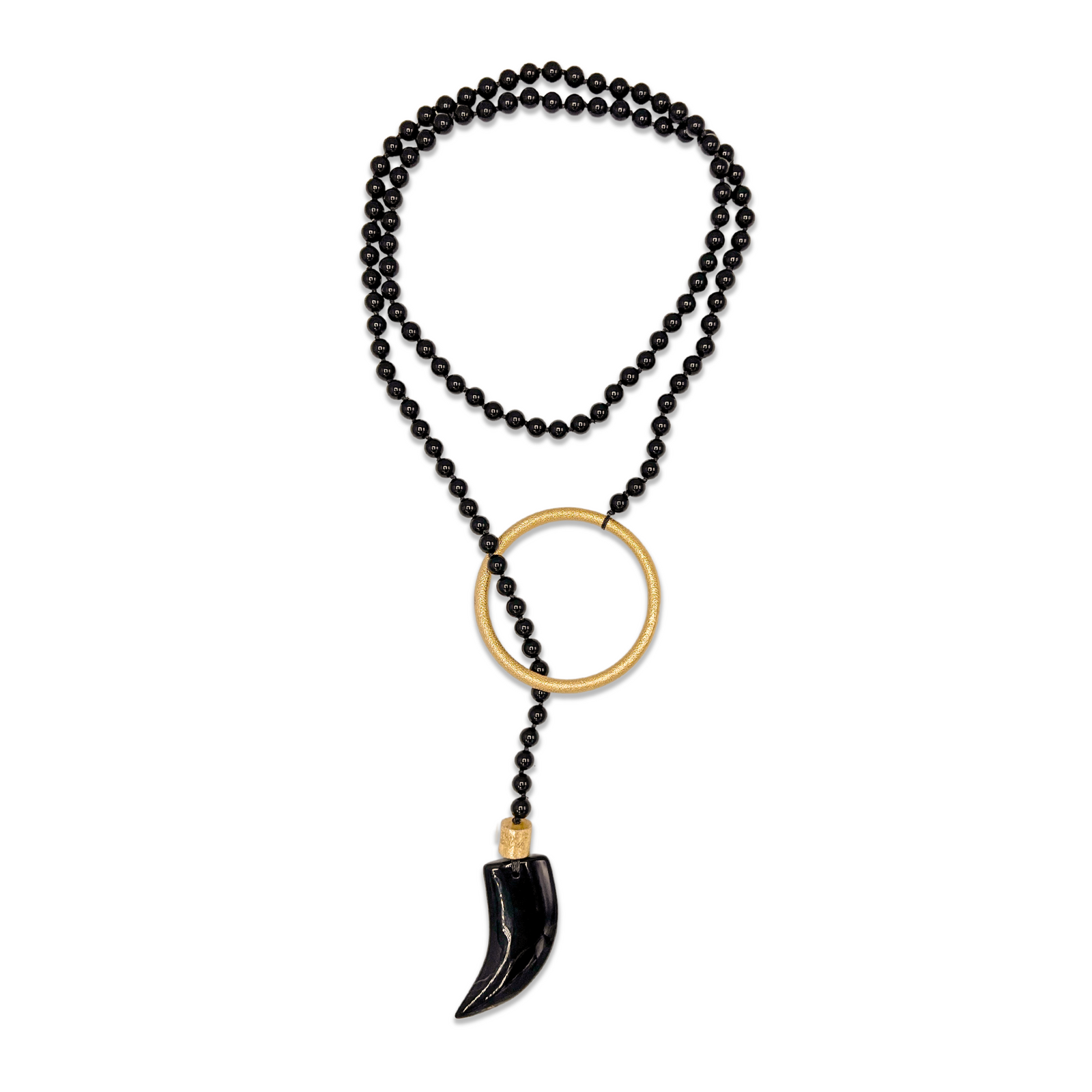 The Tucan Tusk Onyx Necklace by JAREDJAMIN Jewelry Online is a bold 45-inch knotted strand with black beads, an 18K gold plated ring, and an agate tooth-shape pendant with gold cap—striking against a white background.