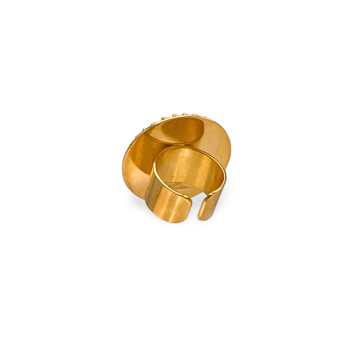 The Starburst Statement Ring by JAREDJAMIN Jewelry Online features an 18K gold-plated, smooth, wide circular disk and an open adjustable band for a modern, sculptural celestial look.