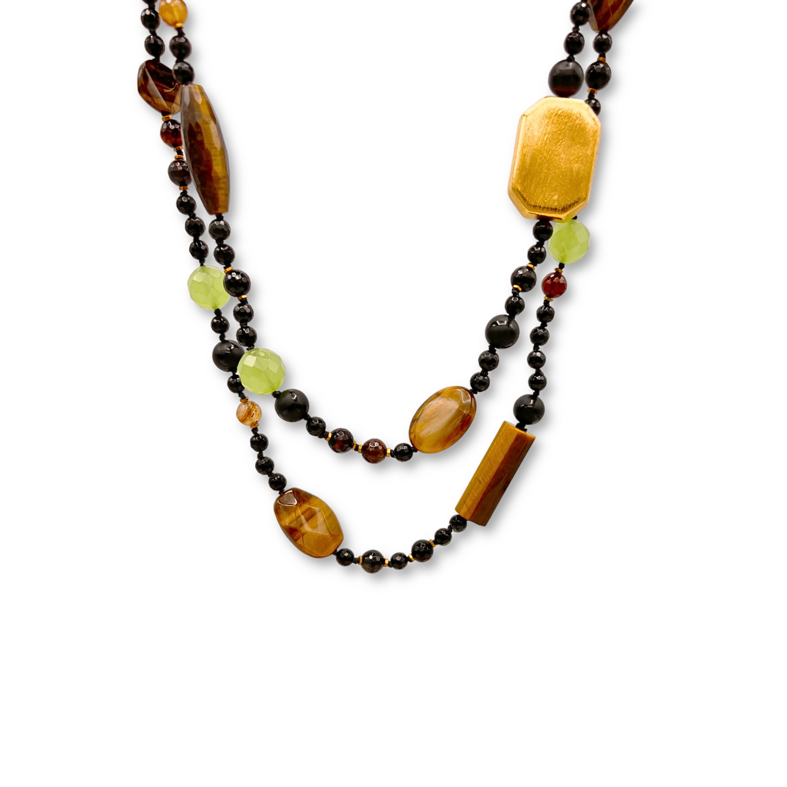 The Sorrento Gemstone Knotted Necklace by JAREDJAMIN Jewelry Online features multiple strands of polished tiger’s eye, faceted green quartz, onyx beads, and gold accents, all secured with a gold toggle clasp.