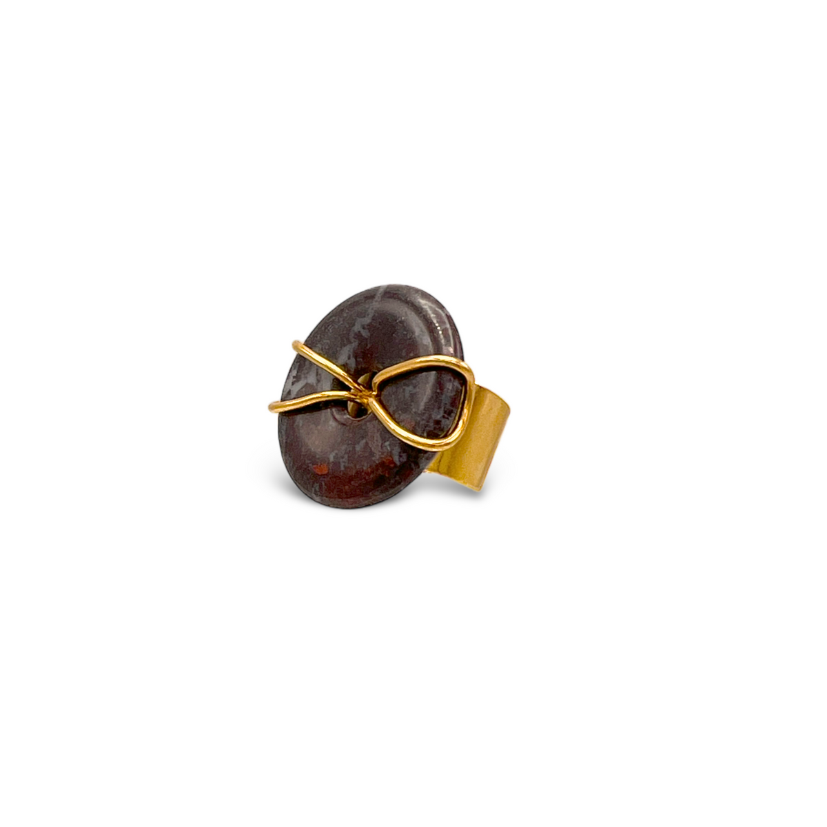 The Gold Cornelia Ring by JAREDJAMIN Jewelry Online features a large round jasper stone set in an asymmetrical 18K gold plated wire on a wide, flat adjustable band. The ring is photographed on a plain white background.