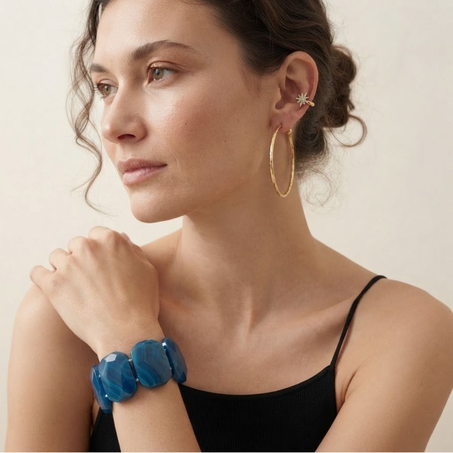 High-resolution studio product shot of the JAREDJAMIN Calypso Blue Agate Chunky Bracelet resting upright on a white background, highlighting the wide, faceted oval-rectangular stone segments and deep blue natural color banding.