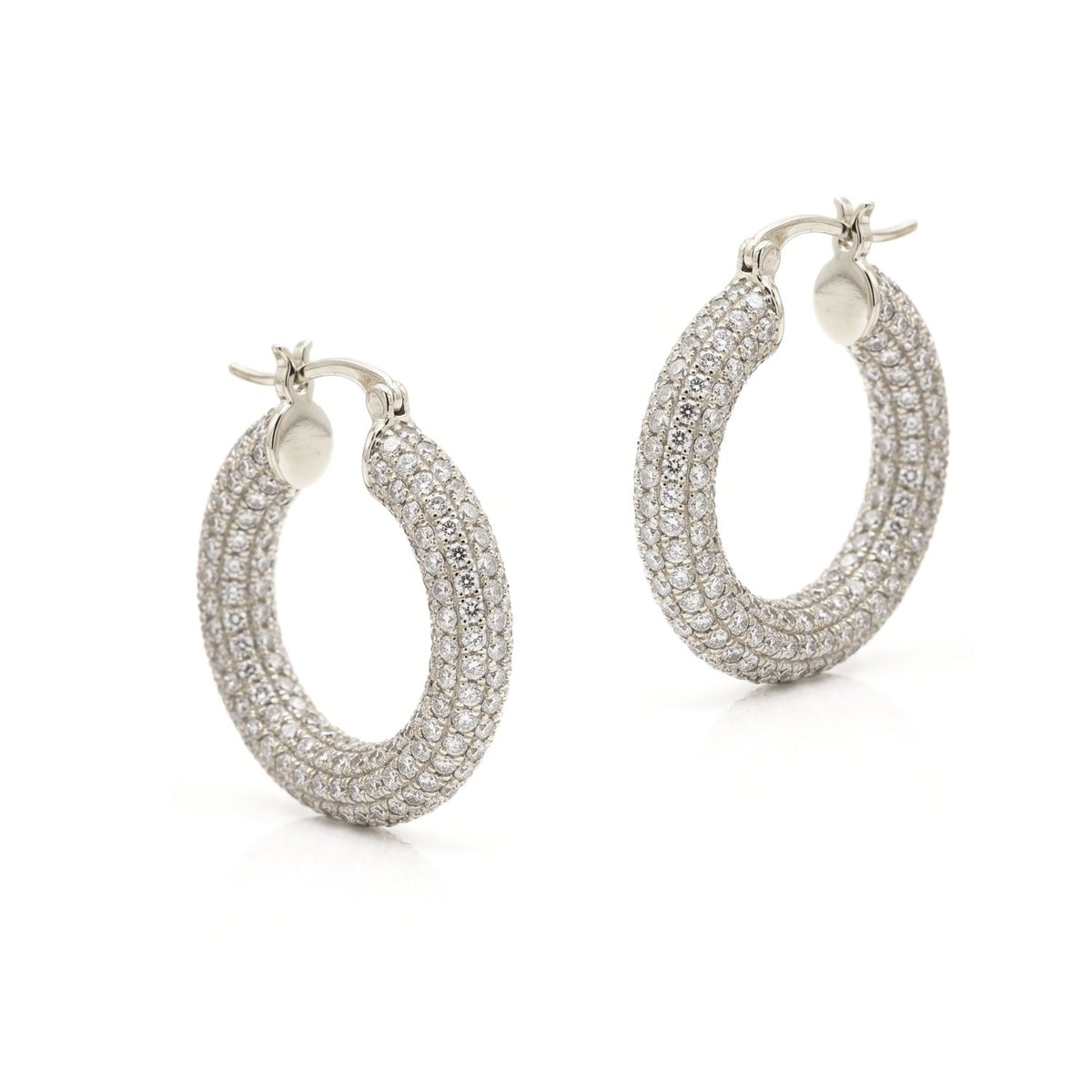 High-resolution studio product shot of the pair of silver-toned JAREDJAMIN Aria Pavé Chubby Hoop Earrings displayed flat against a white background, highlighting their 1-inch diameter, micro-pavé CZ stones, and click-top closures.