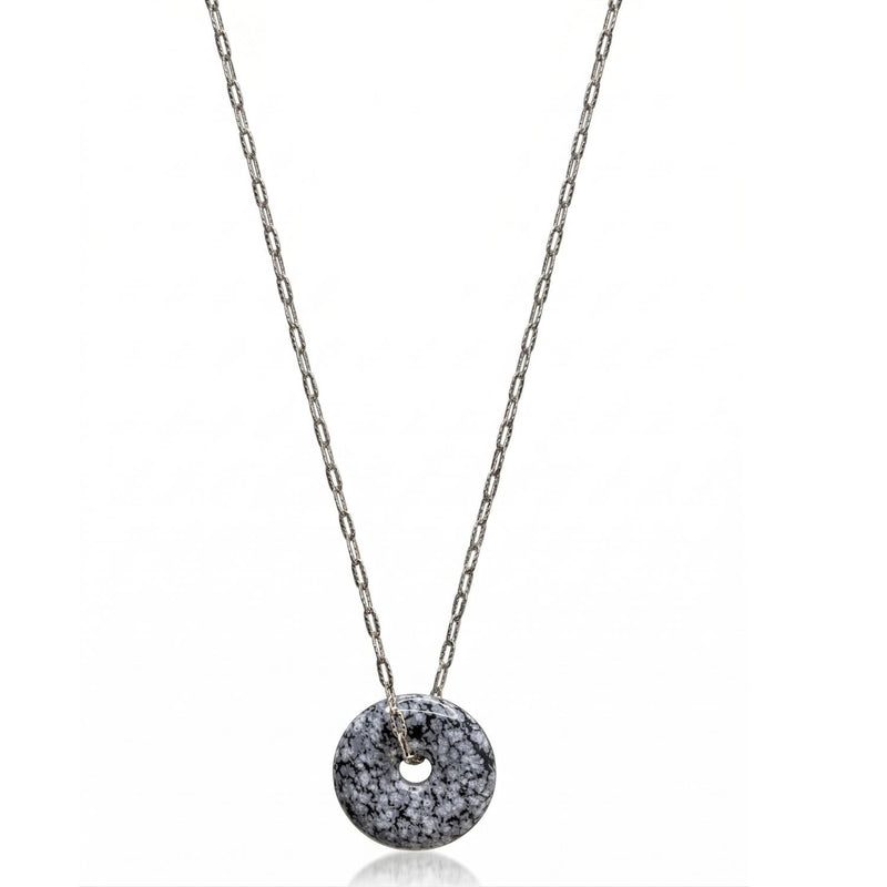 Hand-assembled in our West Hollywood studio, this sterling silver necklace frames a jasper disc scattered with black and white pigment. Produced in mindful small batches. Style Note: punctuates crisp shirting or evening knits with sculptural restraint.
