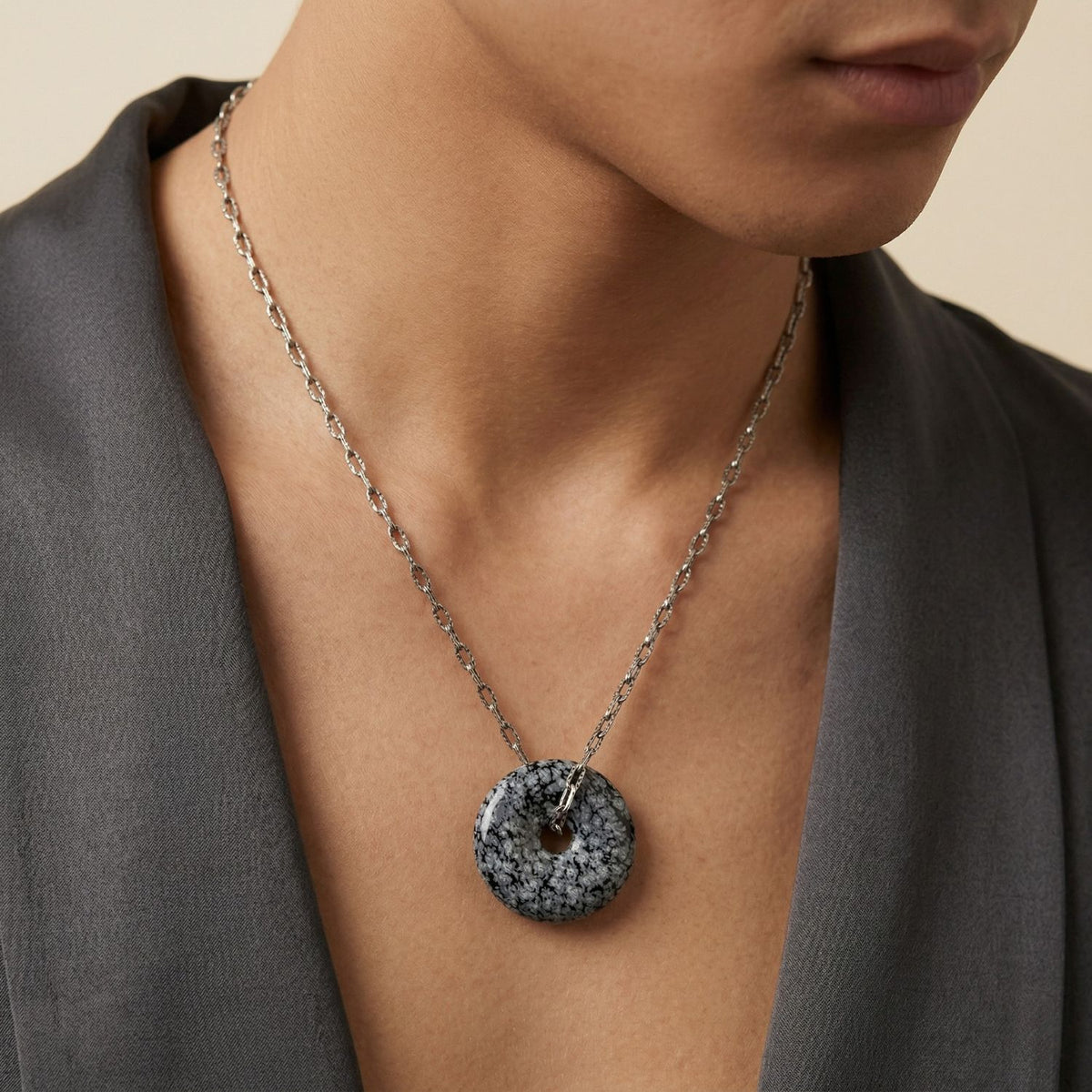 Hand-assembled in our West Hollywood studio, the Ash and Or Sterling Silver Necklace punctuates a gray open-collar shirt with its sculpted snowflake obsidian pendant. Crafted in small batches using eco-conscious methods. Style Note: Elevates casual to evening layers.