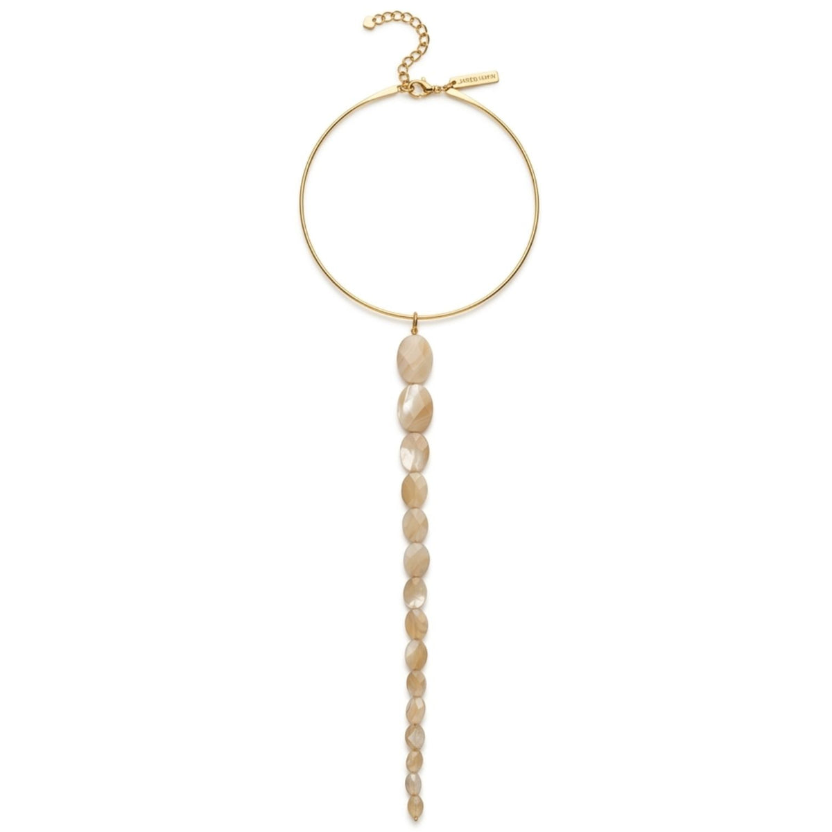 Studio product shot of the Brisa Convertible Necklace arranged on a white background, highlighting the perfectly circular gold-plated rigid torque neck ring, the detailed hand-knotted cord work, and the graduated beige-khaki oval mother of pearl drop pendant attached at the center base.
