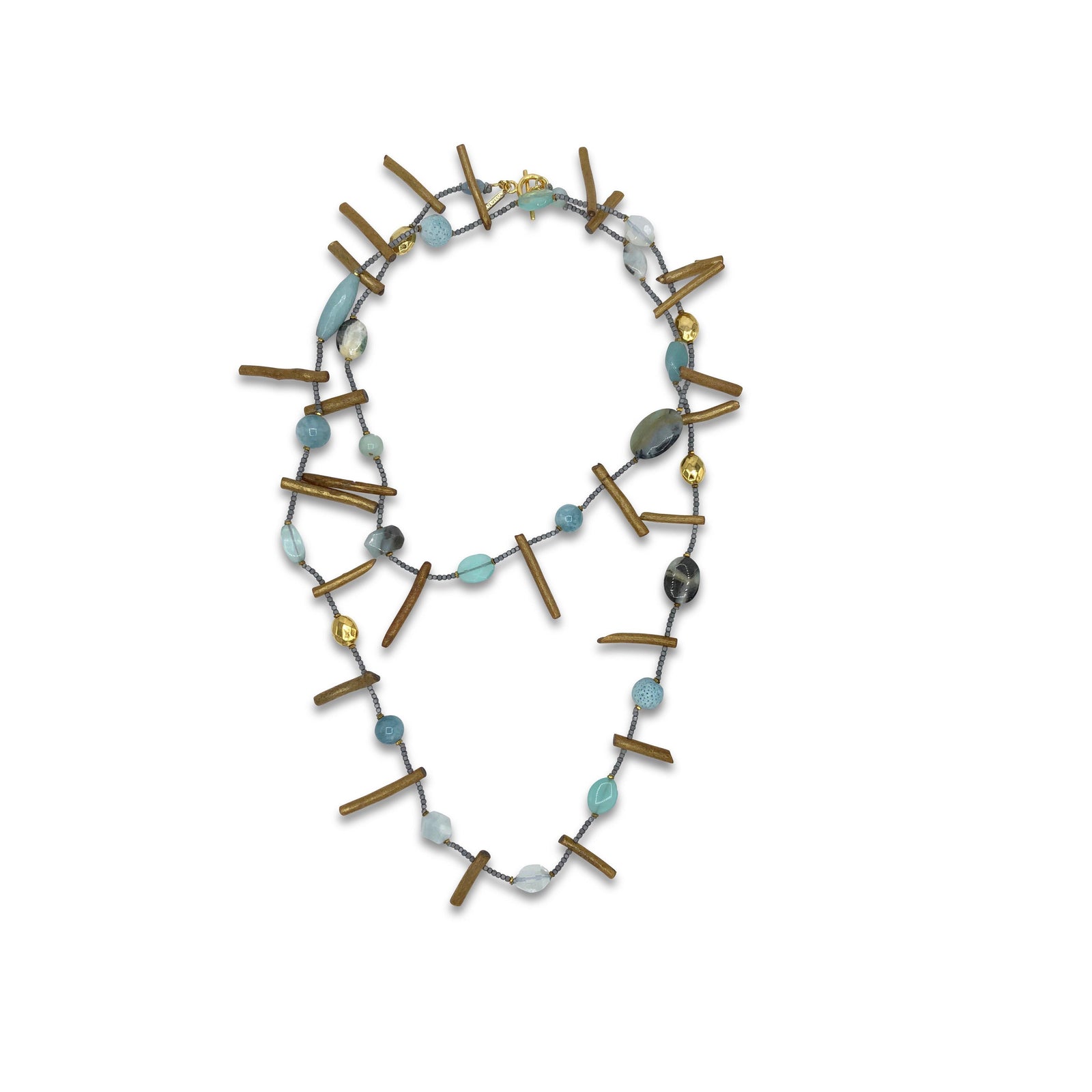 The Beach Dunes Long Necklace by JAREDJAMIN Jewelry Online features irregular brass bars and assorted blue, aqua, gold, and clear gemstone beads on a thin dark chain with an 18K gold plated clasp. Coiled in a loose loop.