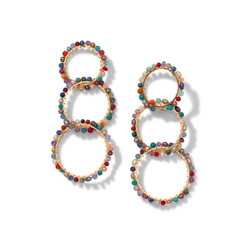 Les Begemmed Lindy 18K or Plated boucles d'oreilles par JAREDJAMIN Bijoux en Ligne présentent three connected créoles adorned avec small round beads et gemstones in red, blue, green, et purple symmetrically around the edges.