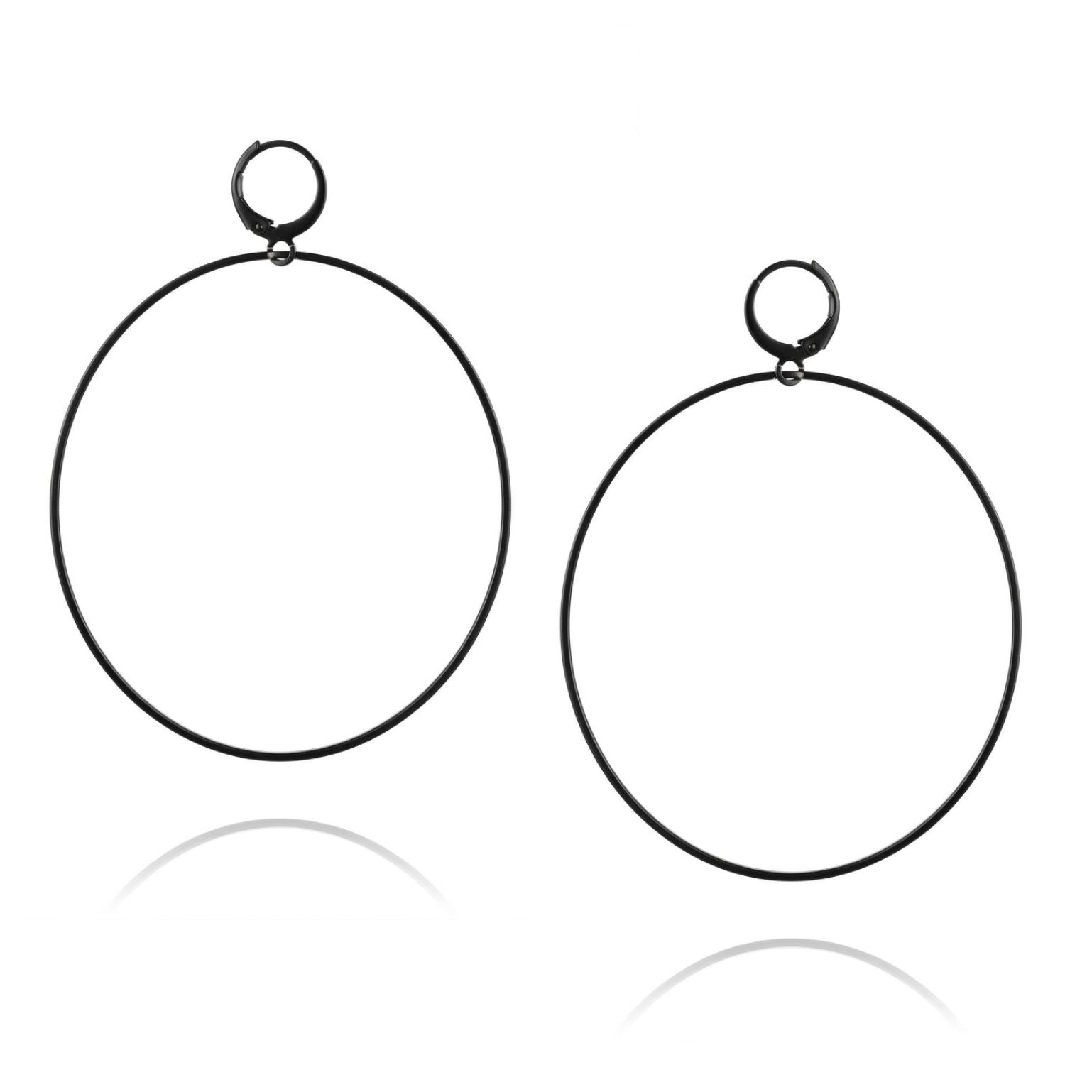 High-resolution studio product shot of the pair of JAREDJAMIN Nyx Black Halo Earrings against a crisp white backdrop, displaying their oversized circular shape and matte black finishes.