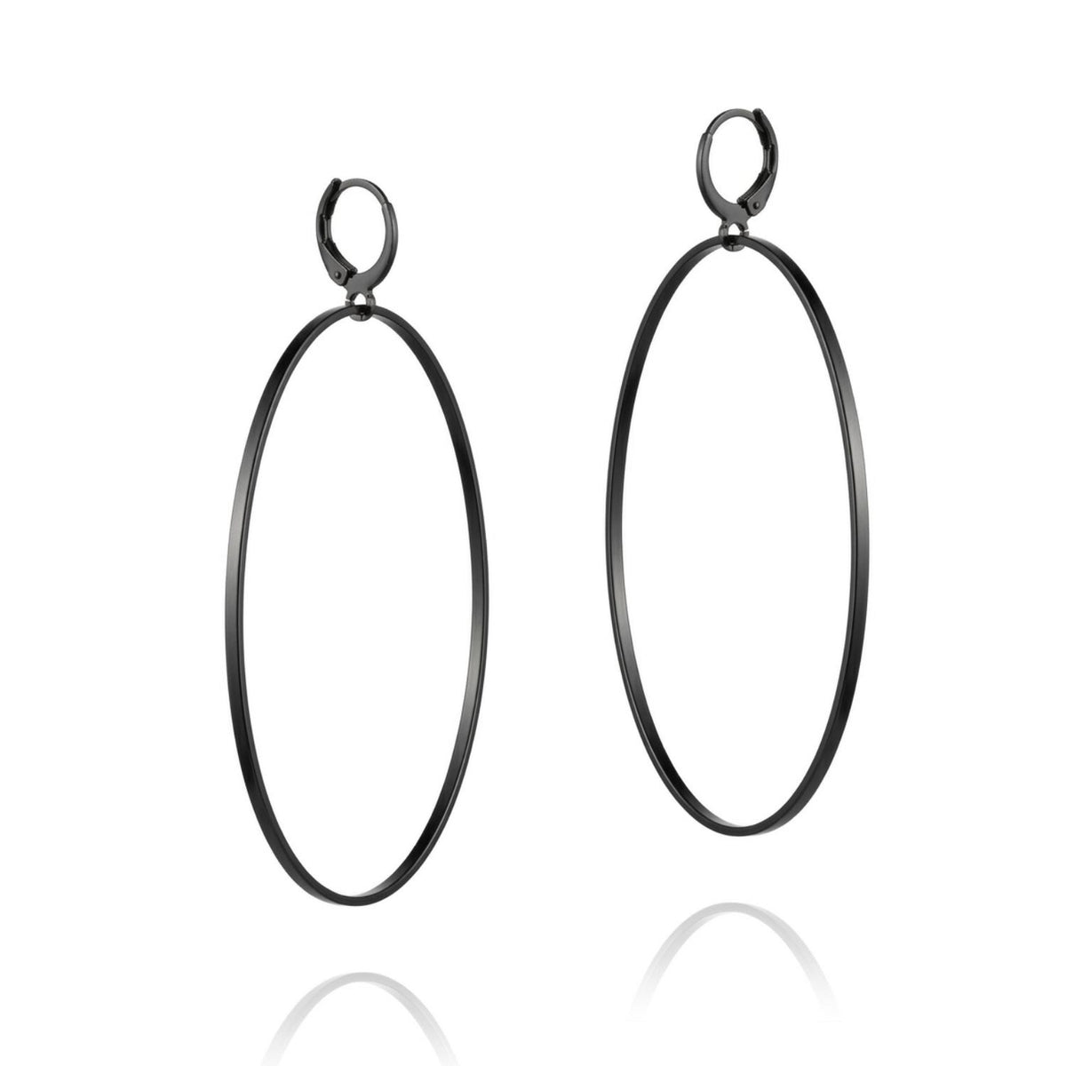 Angled studio shot of the matte black textured hoop earrings, highlighting the secure lever back fastening mechanisms and the subtle, hand-hammered texture along the rim.