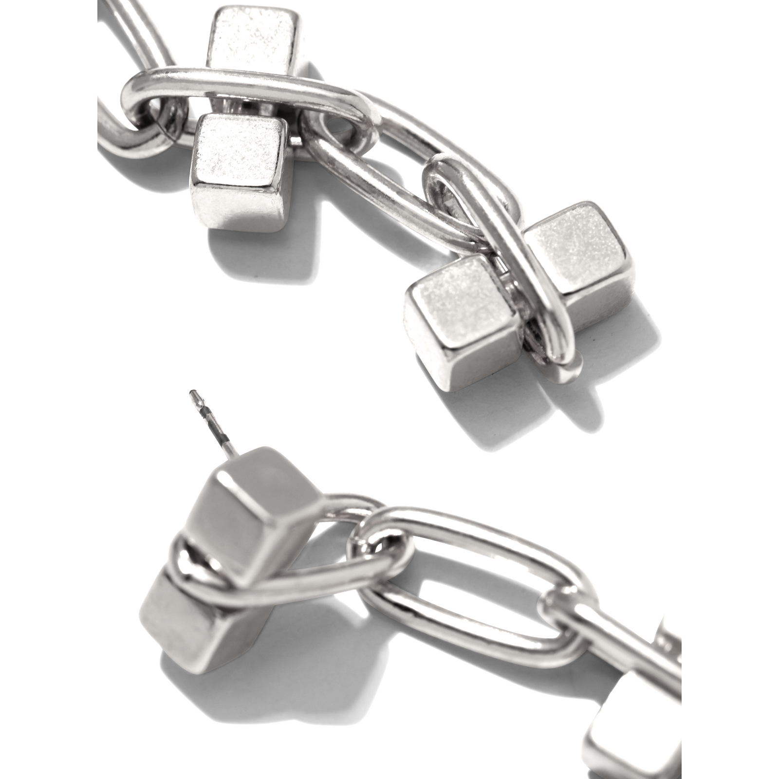 The Silver Blockbuster 4 Block Earrings by JAREDJAMIN Jewelry Online feature silver-plated brass with a geometric chain of three oval links and rectangular bars, creating a modern look that stands out against a white background.