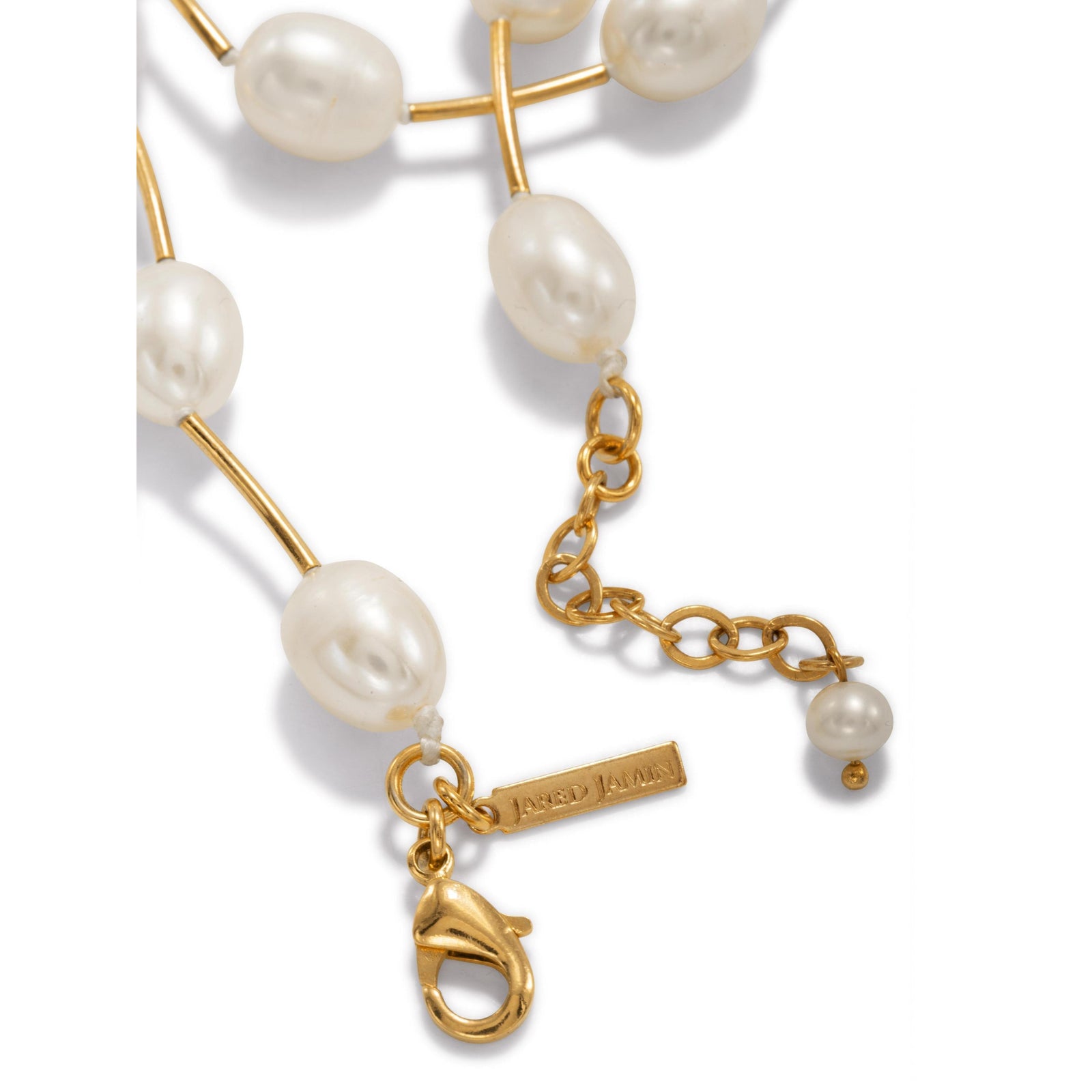 The Claire Pearl and Gold Necklace by JAREDJAMIN Jewelry Online features white oval pearls and gold tube accents on an 18K gold plated chain with an adjustable clasp and extension for the perfect fit.
