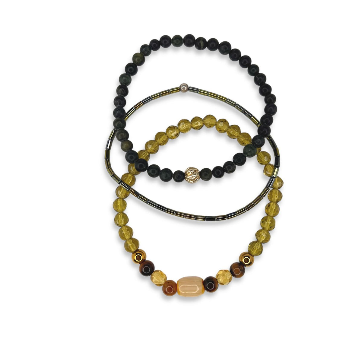 Detailed view of the three-piece Cadence bracelet Set by Jared Jamin, highlighting the contrast between the smooth Jasper, metallic Hematite, et light-catching Chartreuse beads