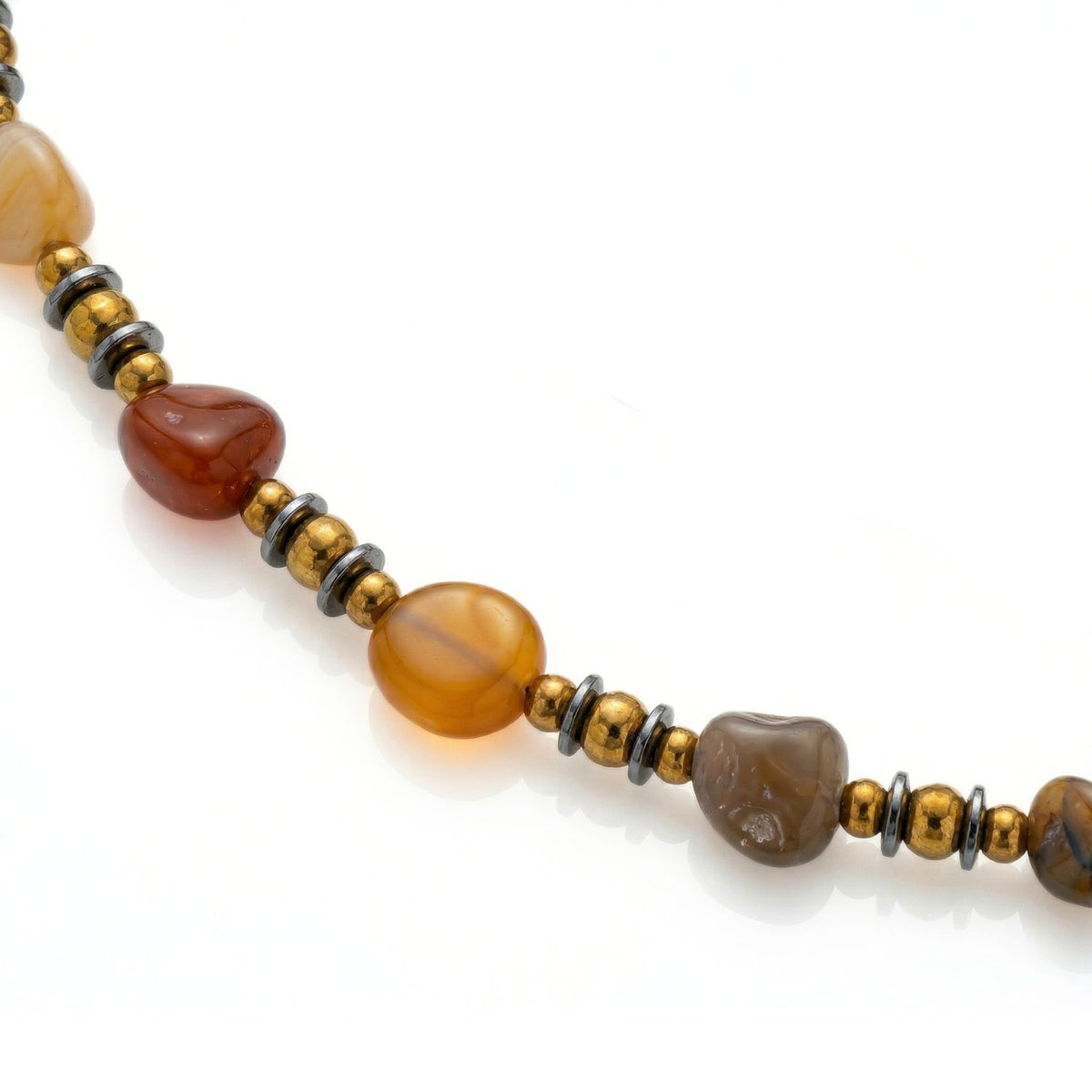 Clayton Agate Necklace, hand-assembled in our West Hollywood studio: sculpted agate fragments in nuanced earth tones are punctuated by gold and hematite beads, silver-plated clasp. Eco-conscious, small-batch. Style Note: anchors daytime tailoring or pared-back silk.