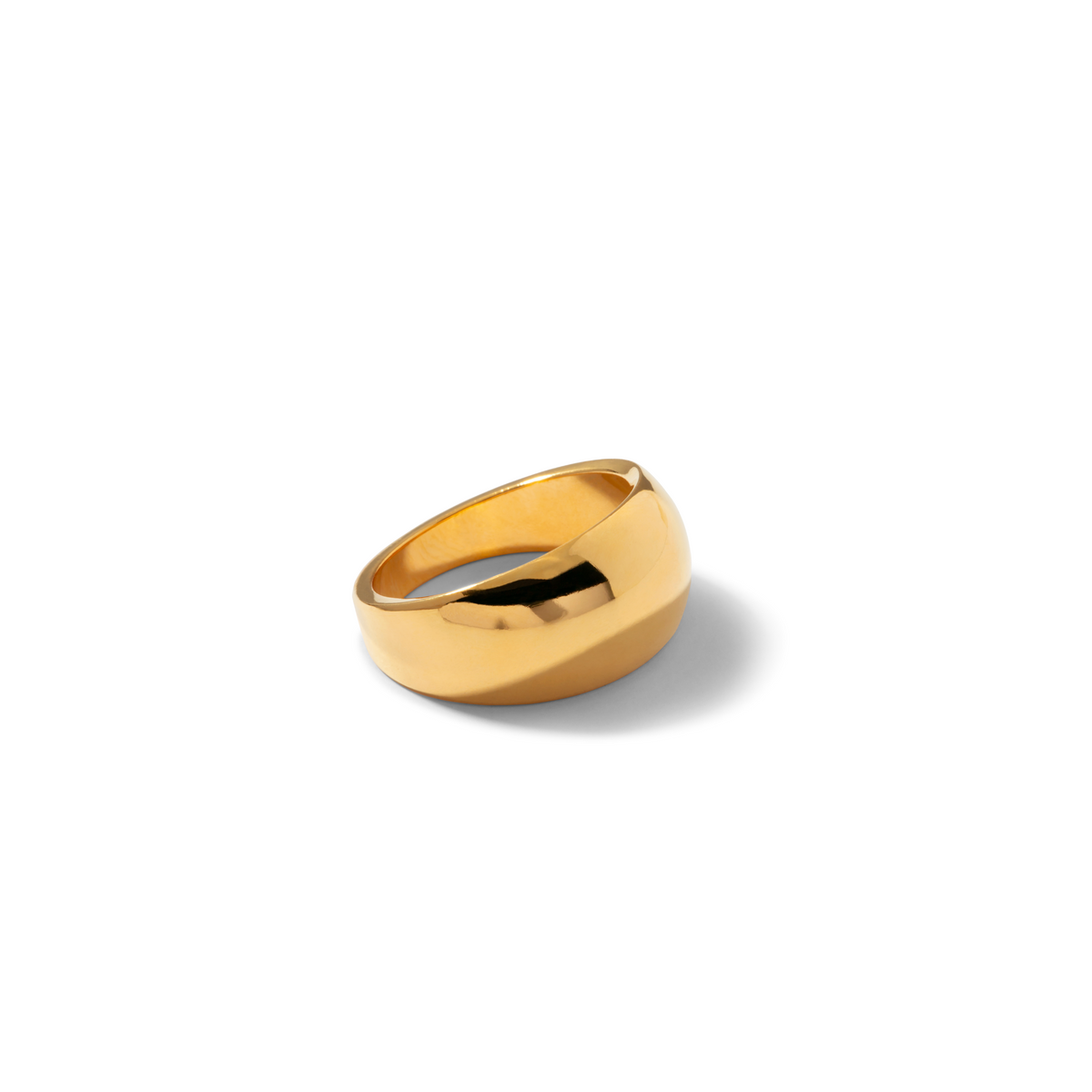 The Smooth Dome Ring by JAREDJAMIN Jewelry Online features a wide, polished gold surface that's tarnish-proof and highly reflective. Its chunky, curved design exudes casual elegance and stands out beautifully against a white background.
