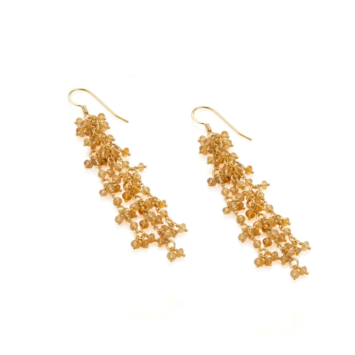 Flat layout view of the gold over sterling Eloise citrine cluster earrings resting on a white surface, showcasing the sleek french hook hardware and the intricate, hand-attached headpin configuration.