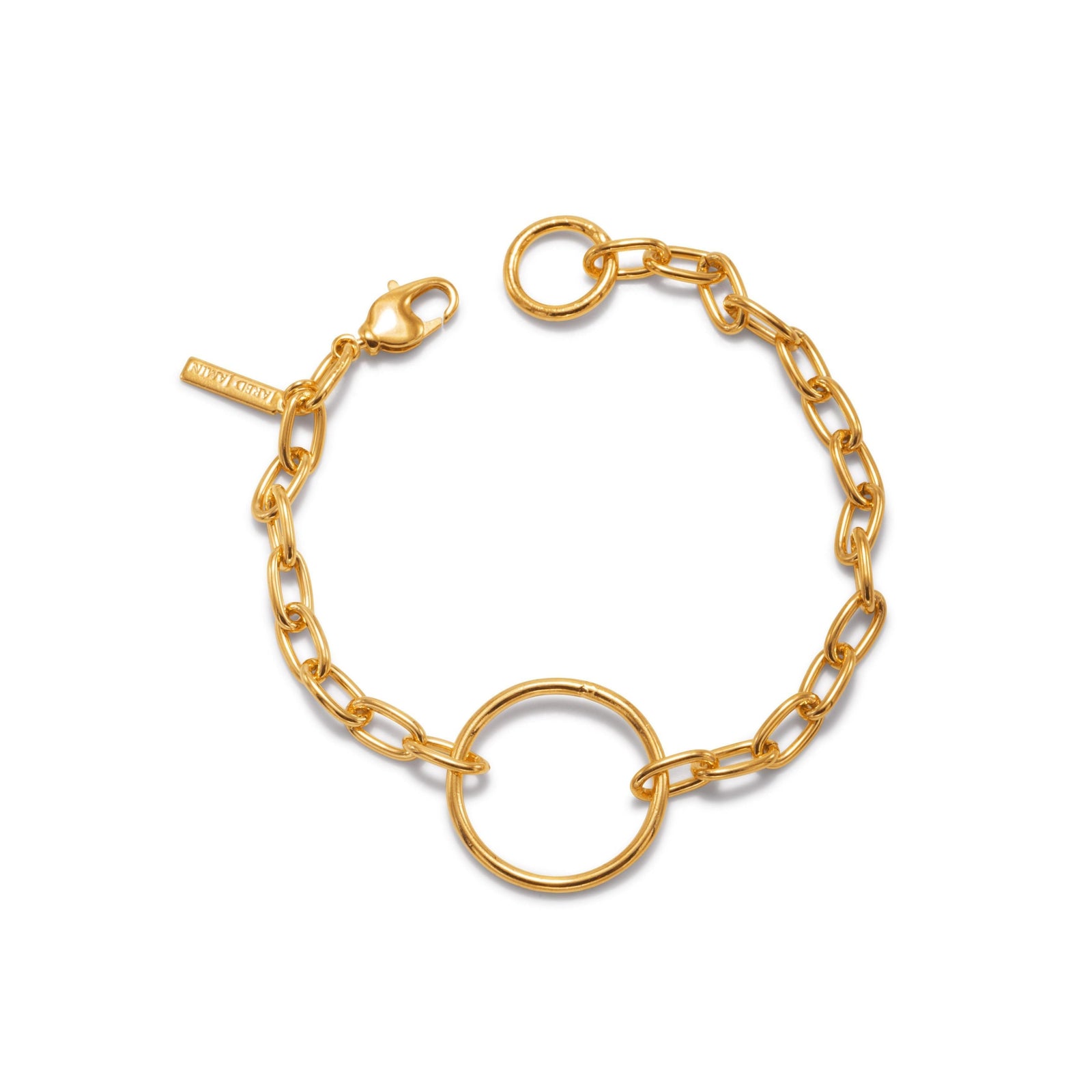 The Gold Chain Reaction Ellipse Bracelet by JAREDJAMIN Jewelry Online features elongated links, a round open ring centerpiece, 18K gold plating, lobster clasp, and "PINKCITY" tag—styled flat on a white background.