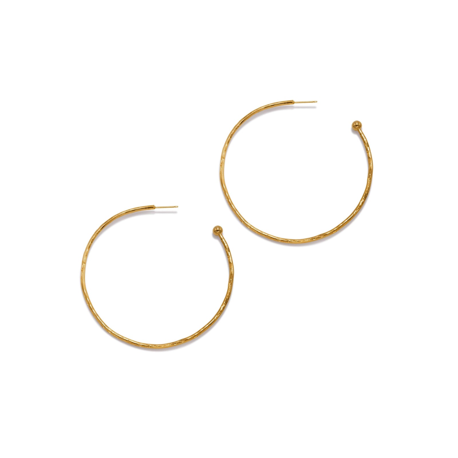 A pair of medium, thin 18K Gold Hooptastic Post Earrings by JAREDJAMIN Jewelry Online with a subtle hammered texture and bead accent. Finished with never-tarnish E-coating for lasting shine. Shown on a plain white background.