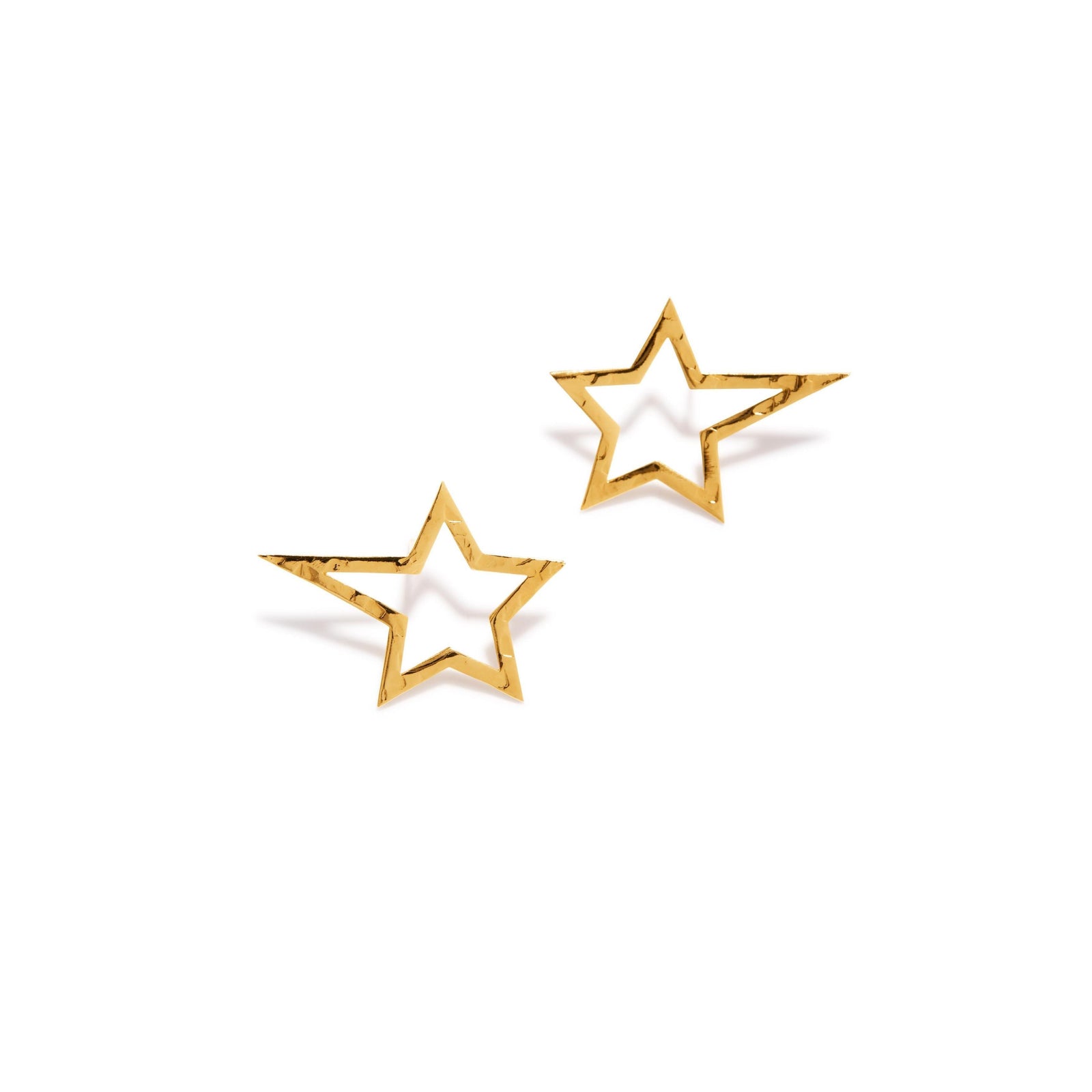 Two Gold Shooting Star Dust Stud Post Earrings Sm by JAREDJAMIN Jewelry Online, featuring a hammered texture and hollow star design, are displayed diagonally on a white background—perfect for a subtle sparkle at the STAR WARS PREMIERE.