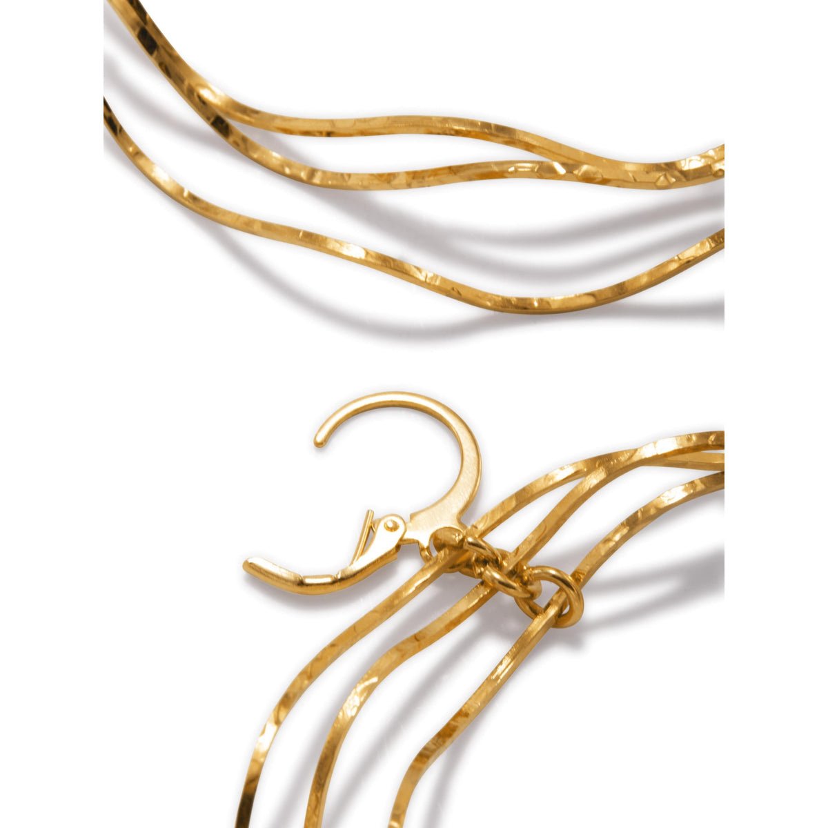 Close-up of JAREDJAMIN Jewelry Online's Gold Triple Wavy Halo Hoop Earrings, featuring textured, wavy hoops crafted from plated brass with a shiny, hammered finish. Shown on a plain white background to highlight elegant curves.