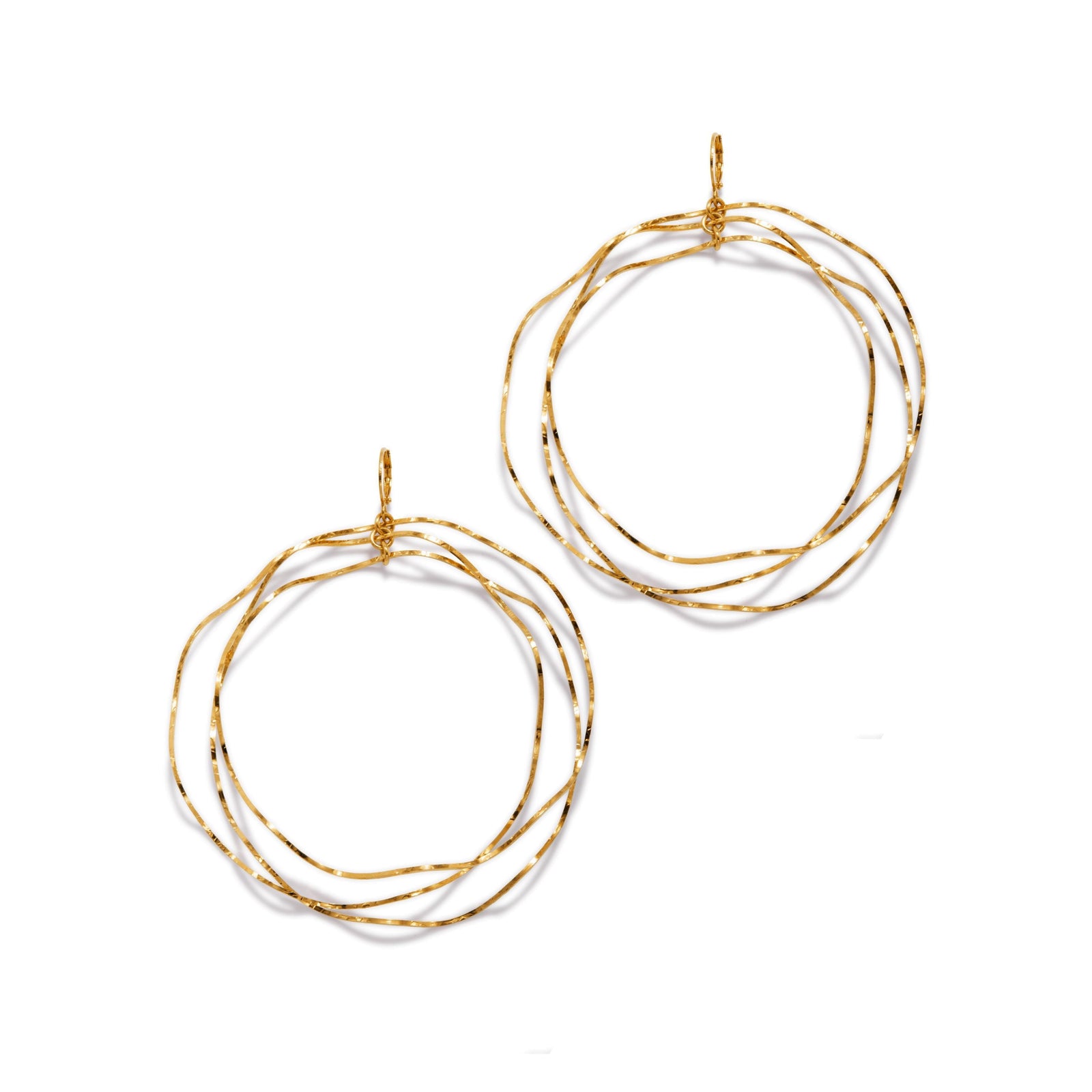 The Gold Triple Wavy Halo Hoop Earrings by JAREDJAMIN Jewelry Online feature three interlocking, irregular gold-plated brass wires with a lightly hammered texture for subtle shine and an organic, layered look.