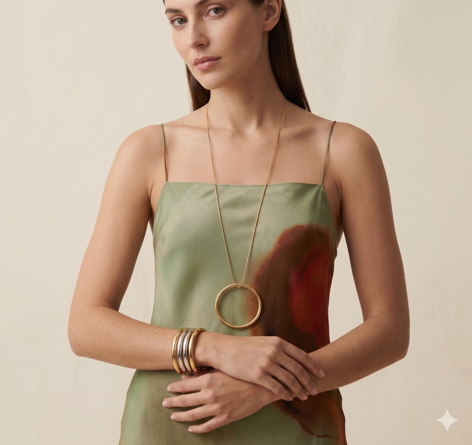 JAREDJAMIN Heavenly Hoop Pendant Necklace in 18k Gold Plate; a 3-inch tubular circle on a dramatic 32-inch snake chain.