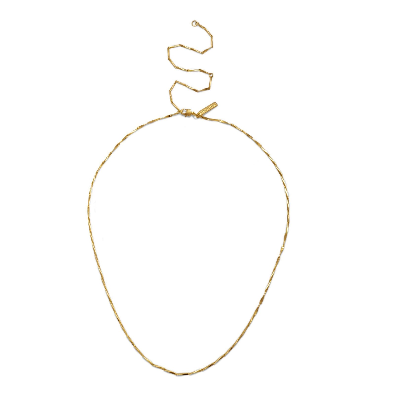 The Faceted Bar Adjustable Chain Necklace by JAREDJAMIN Jewelry Online features a thin, twisted gold chain with an angular extension clasp and a small rectangular tag near the clasp, displayed in a loose spiral on a white background.