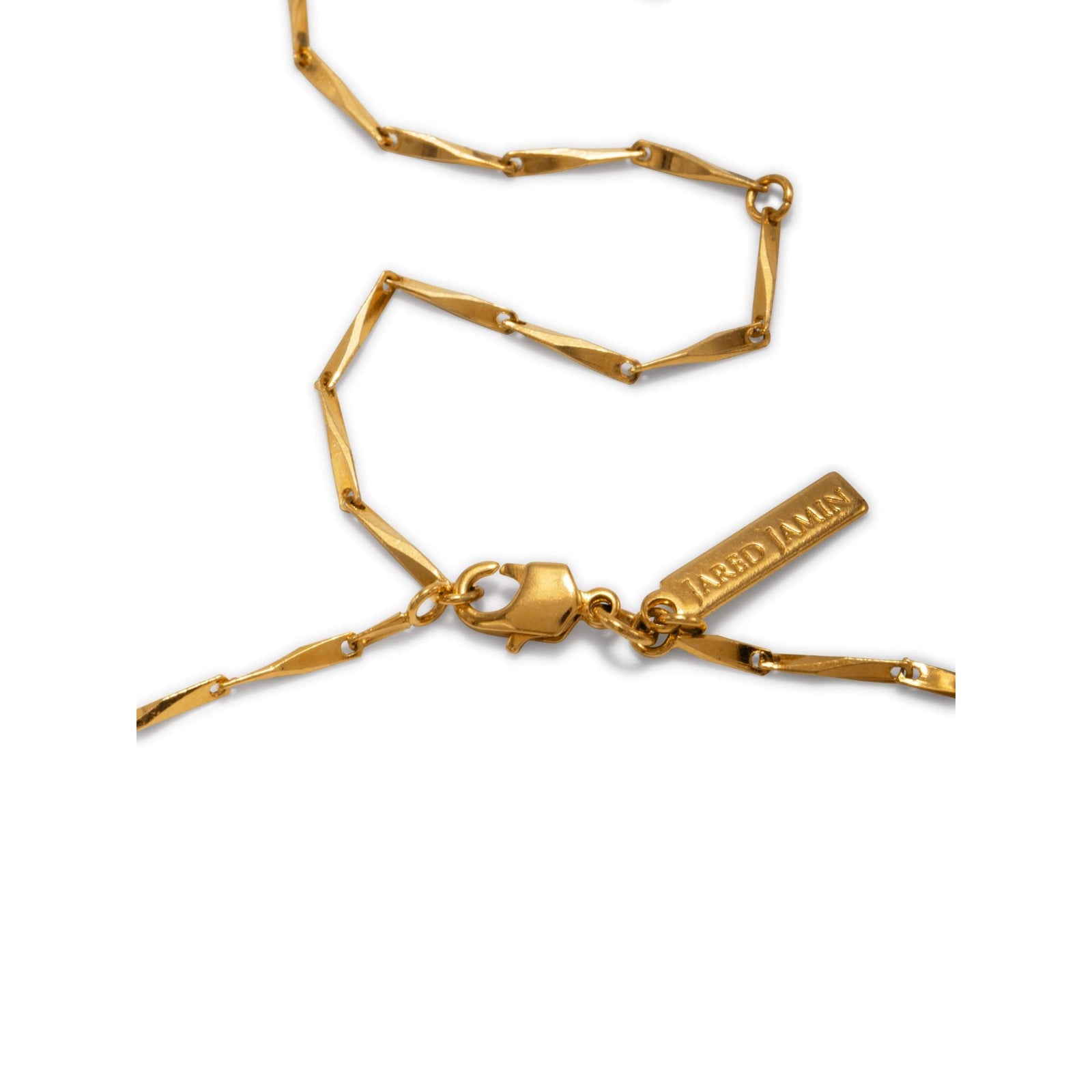 The Faceted Bar Adjustable Chain Necklace by JAREDJAMIN Jewelry Online features a thin, twisted gold chain with an angular extension clasp and a small rectangular tag near the clasp, displayed in a loose spiral on a white background.