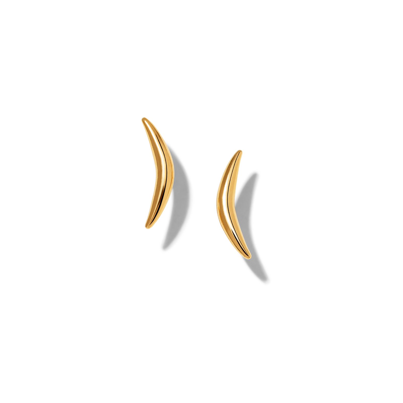The Gold Crescent Stud Post Earrings by JAREDJAMIN Jewelry Online are shown on a white background, featuring a minimalist crescent shape in 18K gold plated finish with smooth edges and a glossy metallic shine.