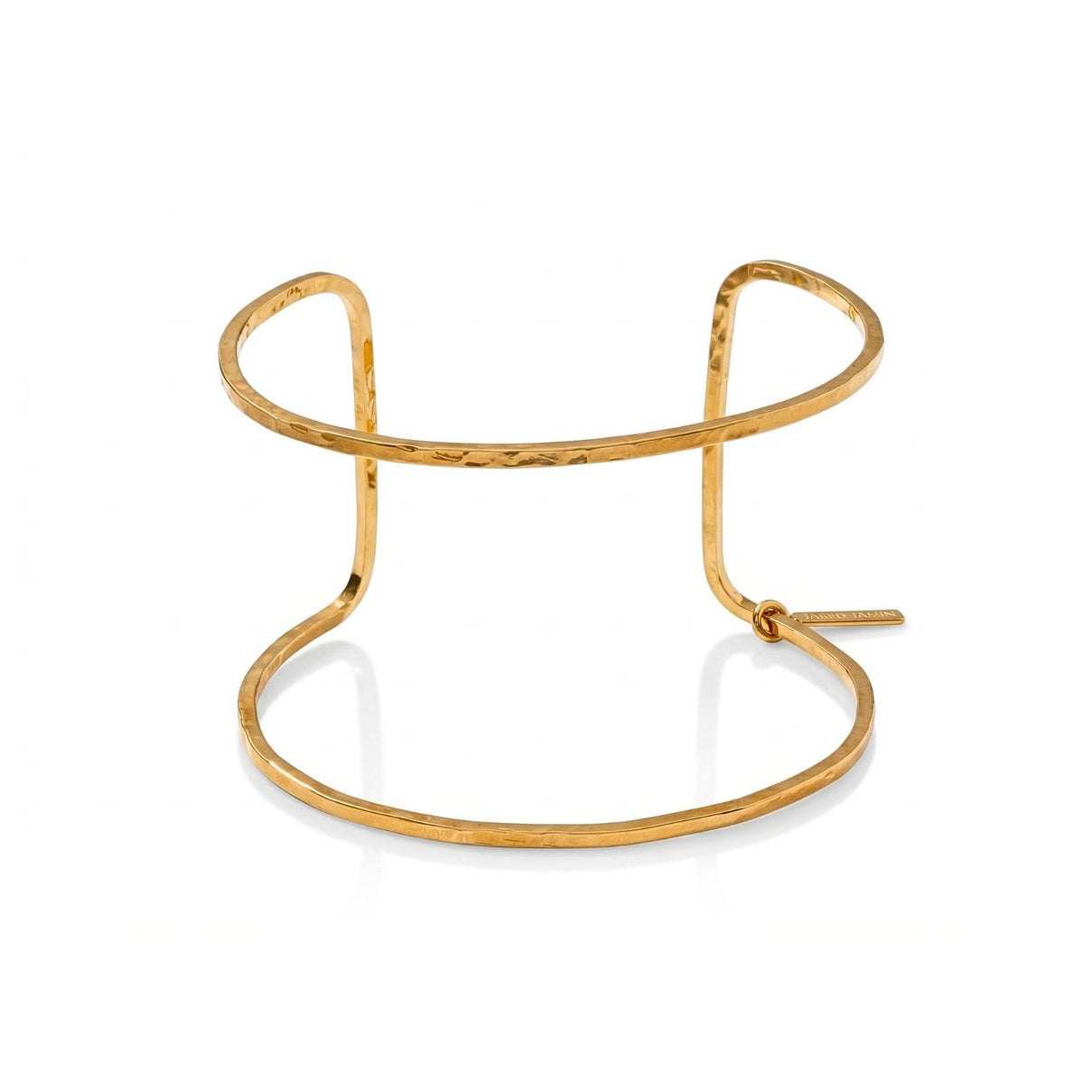 Hand-assembled in our West Hollywood studio, the Gold Halo Forge Cuff sculpts dual hammered bands and a steel-cut tag—each piece small-batch, eco-conscious. Style Note: punctuates layered knits or slips seamlessly into evening minimalism.