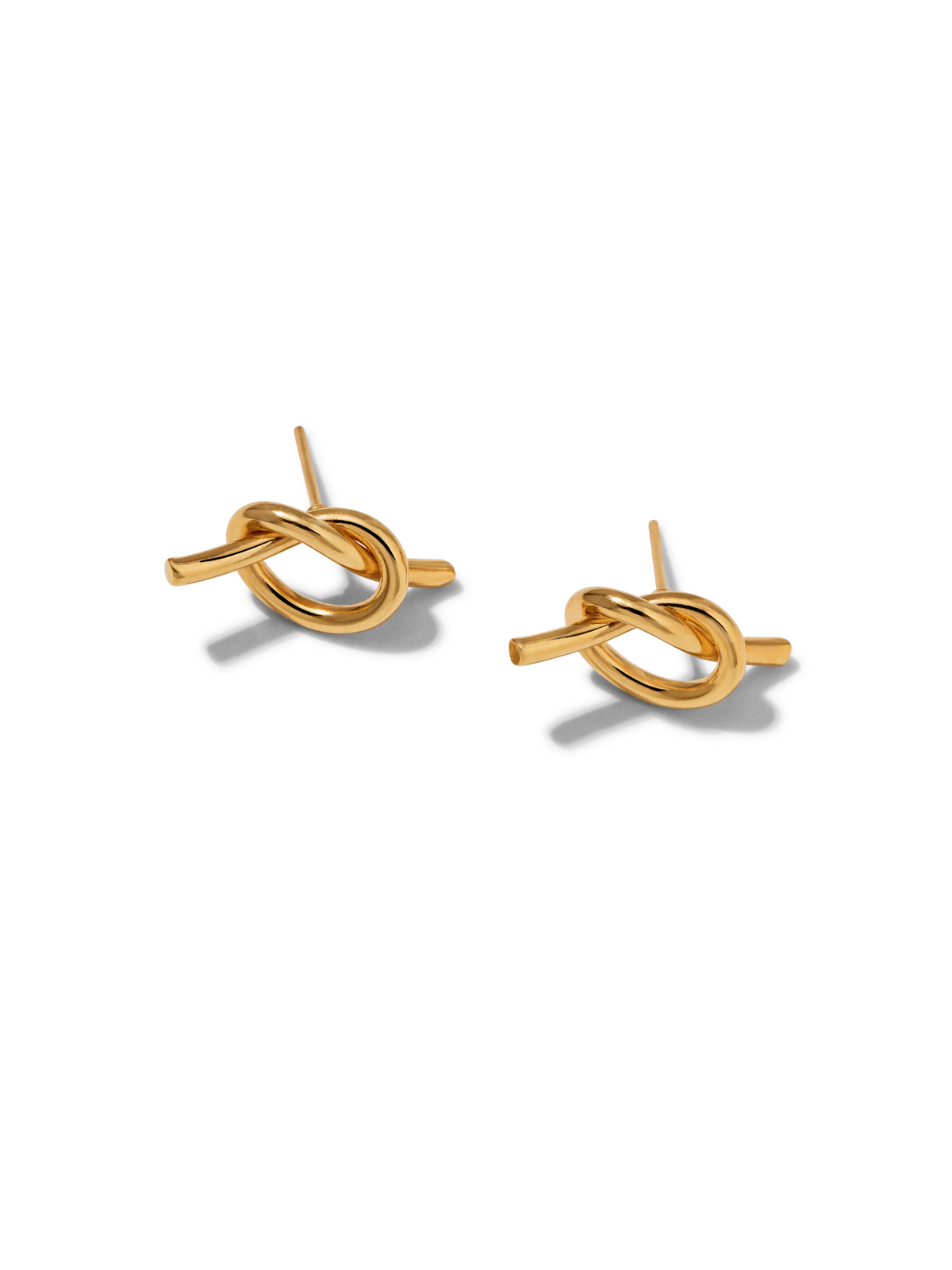 The JAREDJAMIN Jewelry Online Gold Why Knot Stud Post Earrings are 18K gold plated with a smooth, shiny, knot-shaped design made for pierced ears, shown on a white background with soft shadows.