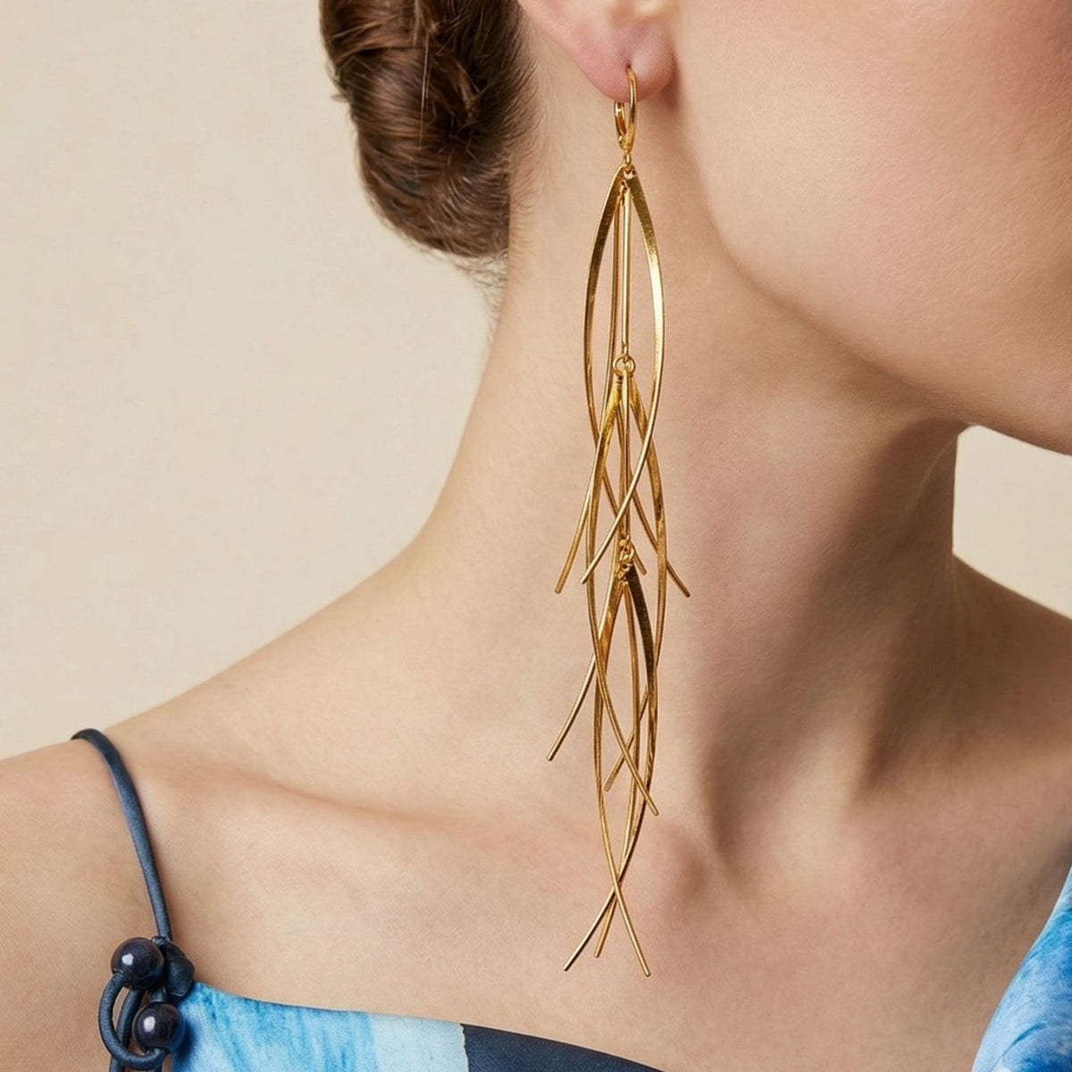 Gold Long Tinsel Earrings by JAREDJAMIN Jewelry Online, large 18K gold-plated with elongated leaf shapes and signature brushed finish. Artisanal craftsmanship small-batch/West Hollywood, sustainable luxury, low carbon footprint.