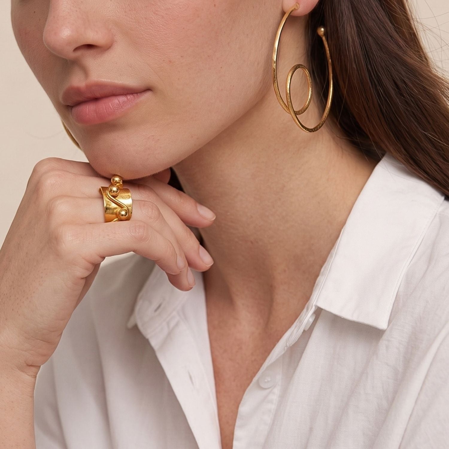 The JAREDJAMIN Jewelry Online Gold Loop-De-Loop Hoop Post Earrings feature large open circles, smaller spiral loops, and gold balls, all enhanced by 18K gold plating and a hammered texture on a white background.