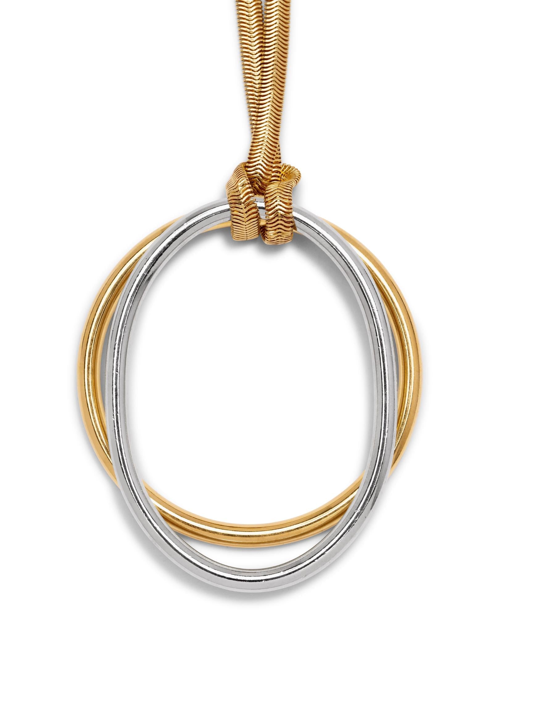 The Gold Lulu Pendant Chain Necklace by JAREDJAMIN Jewelry Online features two interlocking rings—one 18K gold plated, one silver—on a long tan cord with a gold clasp for a sleek, modern minimalist style.