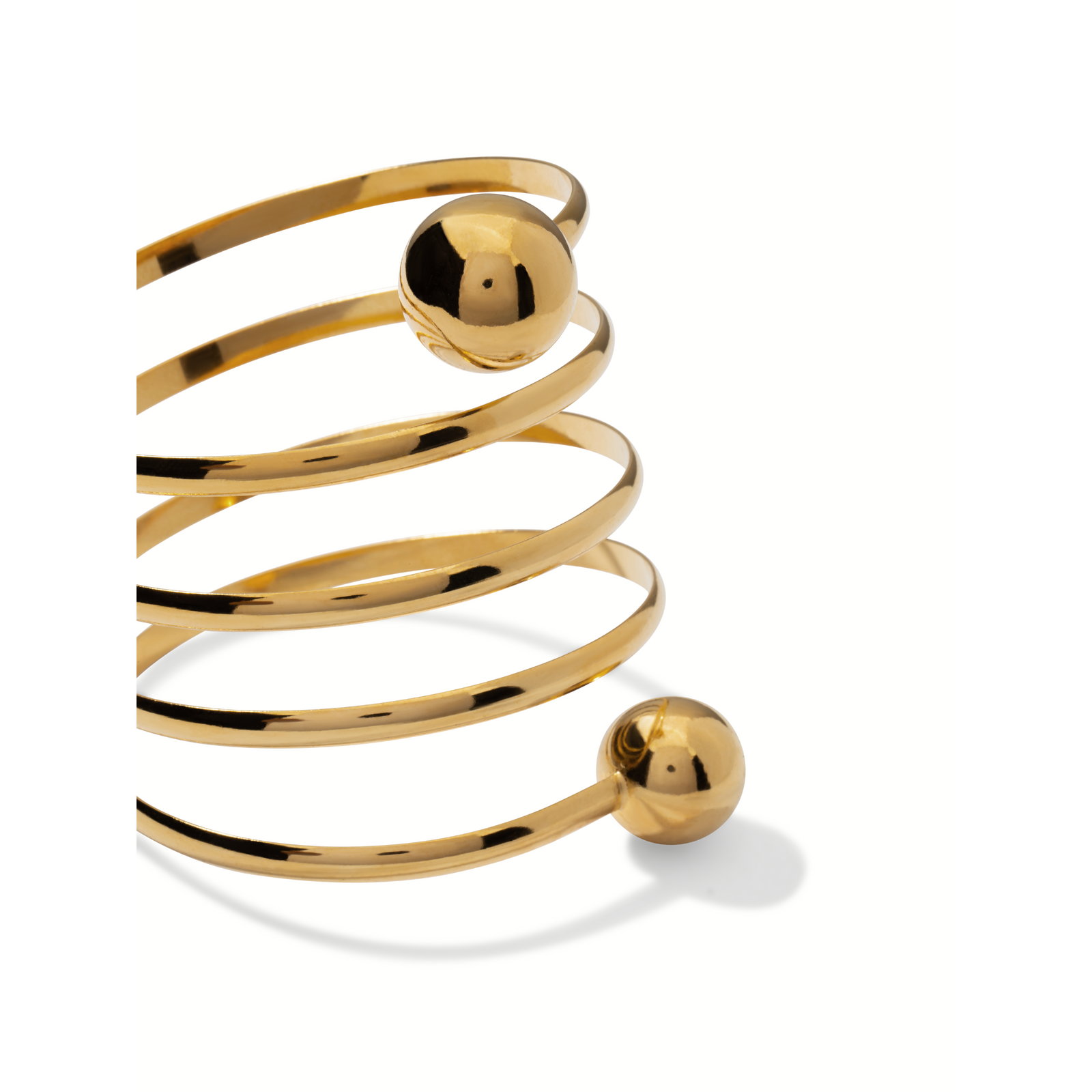 The Gold Orbita Spiral Bracelet by JAREDJAMIN Jewelry Online features a sleek 18K gold-plated open coil design with polished gold spheres at each end, showcasing a modern, minimalist style and reflective finish.