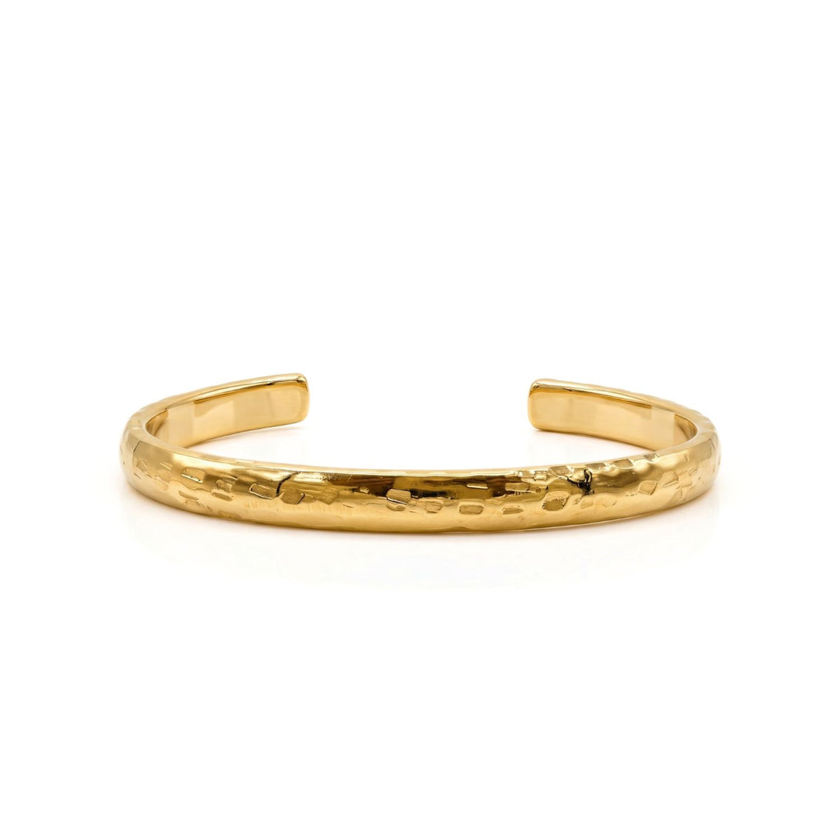 The Gold Parker Textured Cuff sculpts 18k gold-plated brass into an open, hand-hammered form—crafted in small batches in our West Hollywood studio using eco-conscious methods. Style Note: punctuates looks from tailored shirting to slip dresses with quiet assurance.