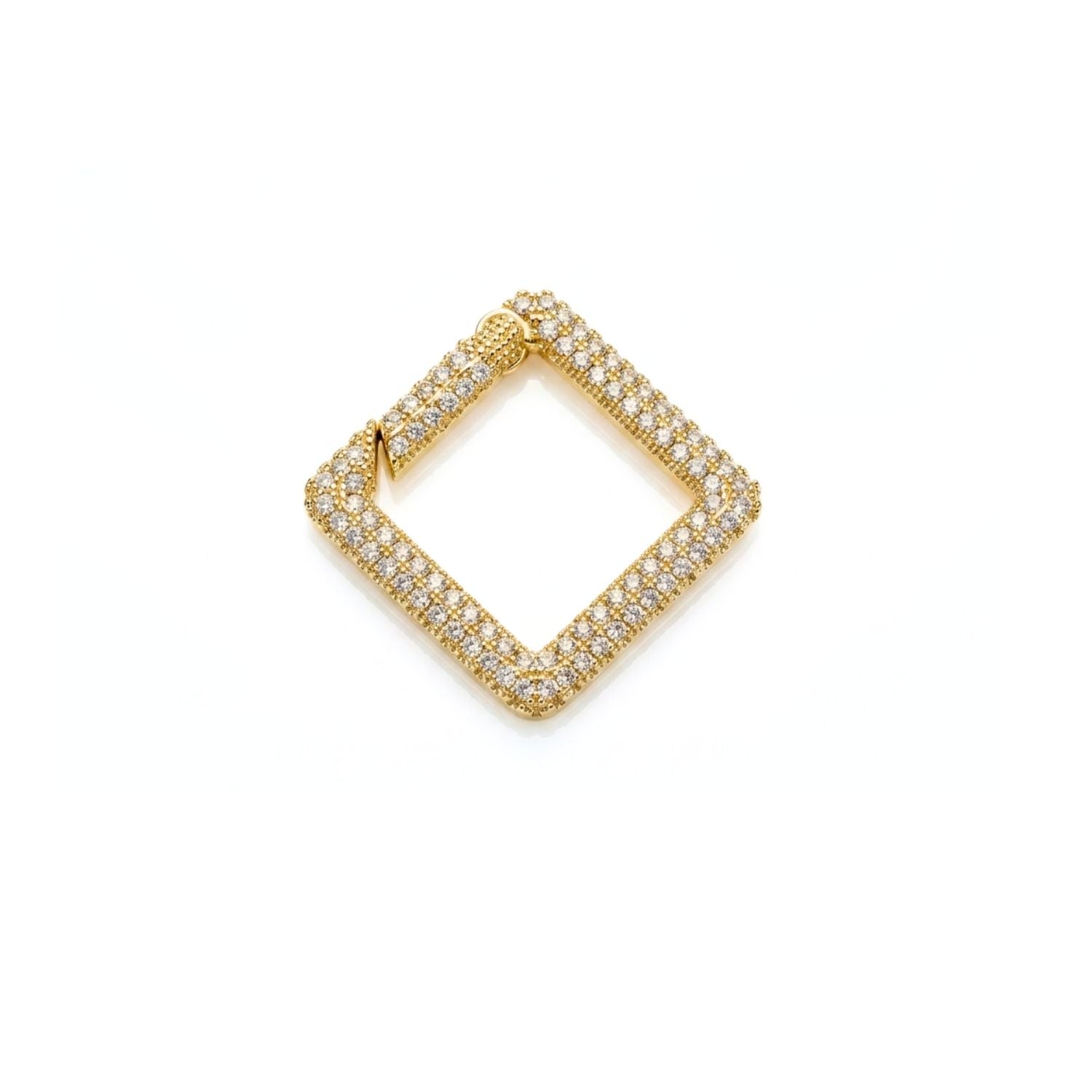 Studio macro shot of the 18k gold-plated JAREDJAMIN Pavé Square Clicker Clasp against a clean white backdrop, showcasing its pavé cubic zirconia encrusted face and push-gate clicker mechanism.