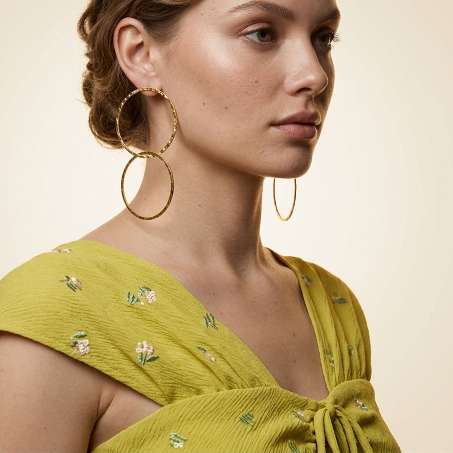 High-resolution studio product shot of the JAREDJAMIN Gold Raquel Dangle Hoop Post Earrings displayed flat on a white background, highlighting the 4.5-inch interlocking double hoop design and textured 18k gold-plated finish.