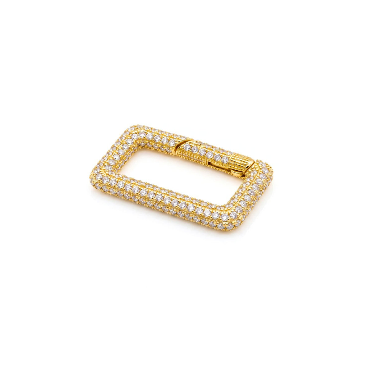 Studio macro shot of the 18k gold-plated JAREDJAMIN Pavé Rectangular Clicker Clasp resting at an angle on a white background, highlighting its 30mm x 17mm CZ-encrusted face and push-gate hinge.