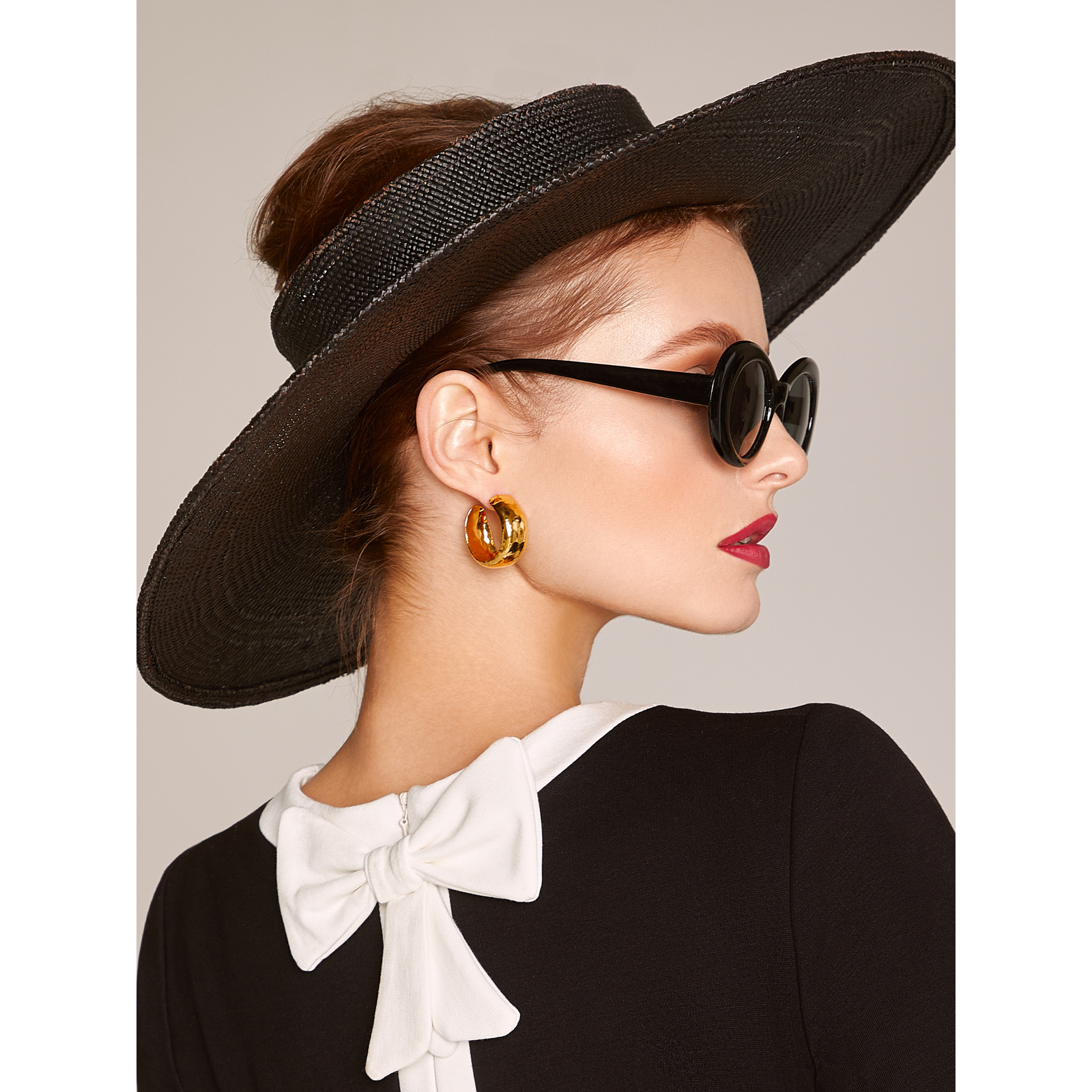 Gold Rush Hoop Earrings by JAREDJAMIN Jewelry Online: chunky 18K gold-plated hoops with a shiny hammered finish, 1 1/4" diameter, post fastenings. Shown side by side on white, casting soft grey shadows to the right.