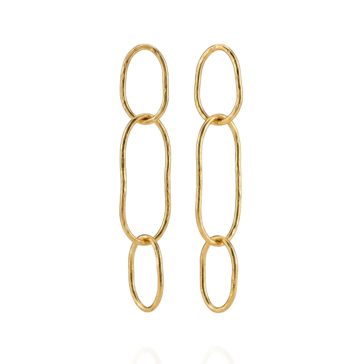 Shackle Link Dangle Post Earrings by JAREDJAMIN Jewelry Online feature three vertically linked, hammered gold ovals in a minimalist design. Their organic shapes and shiny finish are displayed beautifully on a white background.
