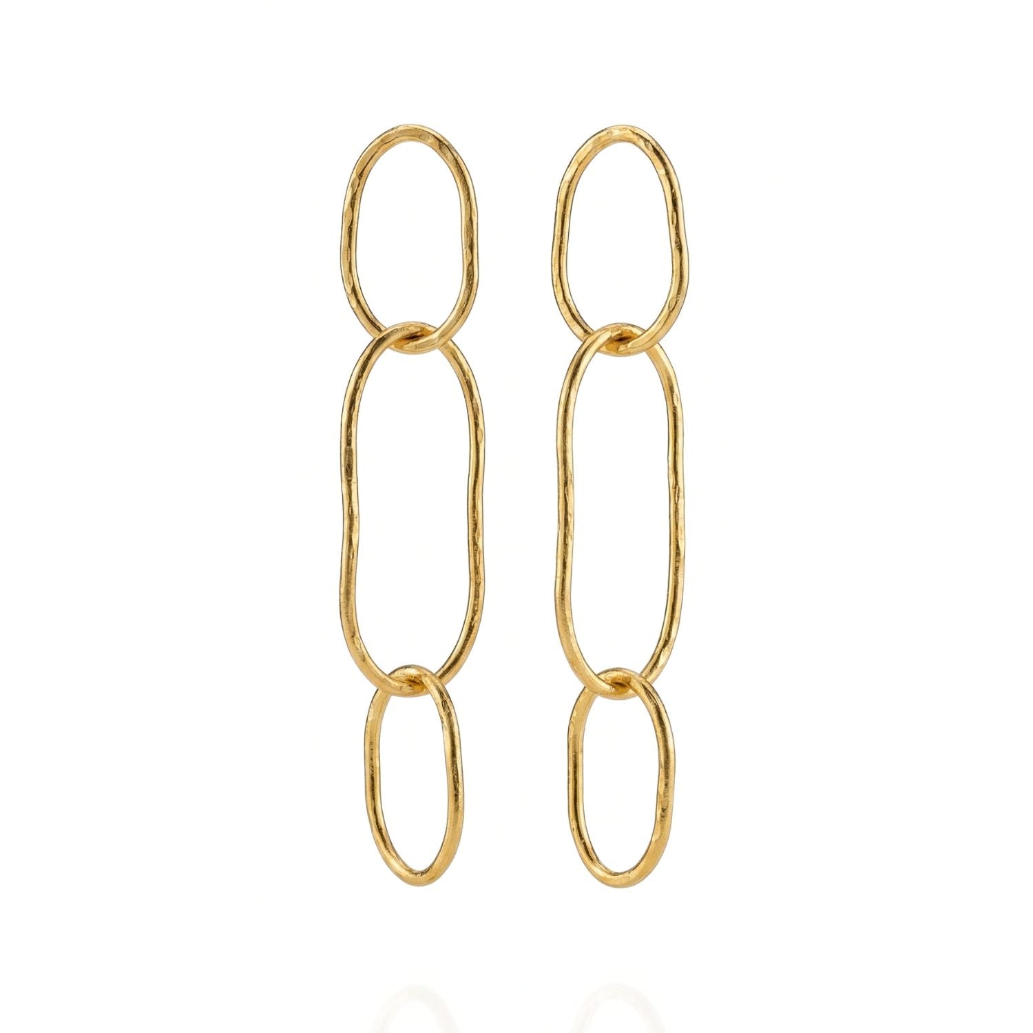 Shackle Link Dangle Post Earrings by JAREDJAMIN Jewelry Online feature three vertically linked, hammered gold ovals in a minimalist design. Their organic shapes and shiny finish are displayed beautifully on a white background.