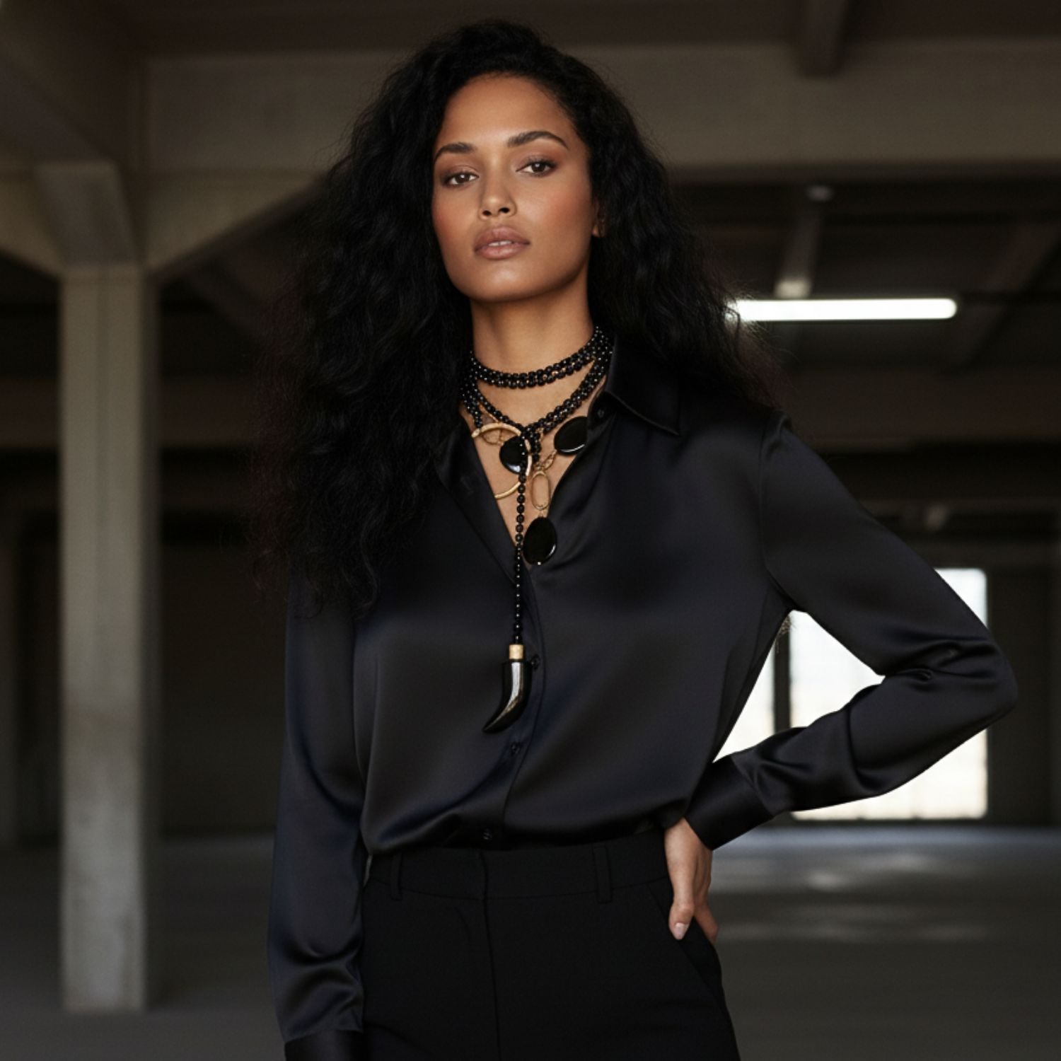 The Gold Shackle Onyx Necklace by JAREDJAMIN Jewelry Online features large, smooth, irregular oval black onyx stones and 18k gold oval links, finished with a central dangling stone and a toggle clasp for bold vintage-inspired style.