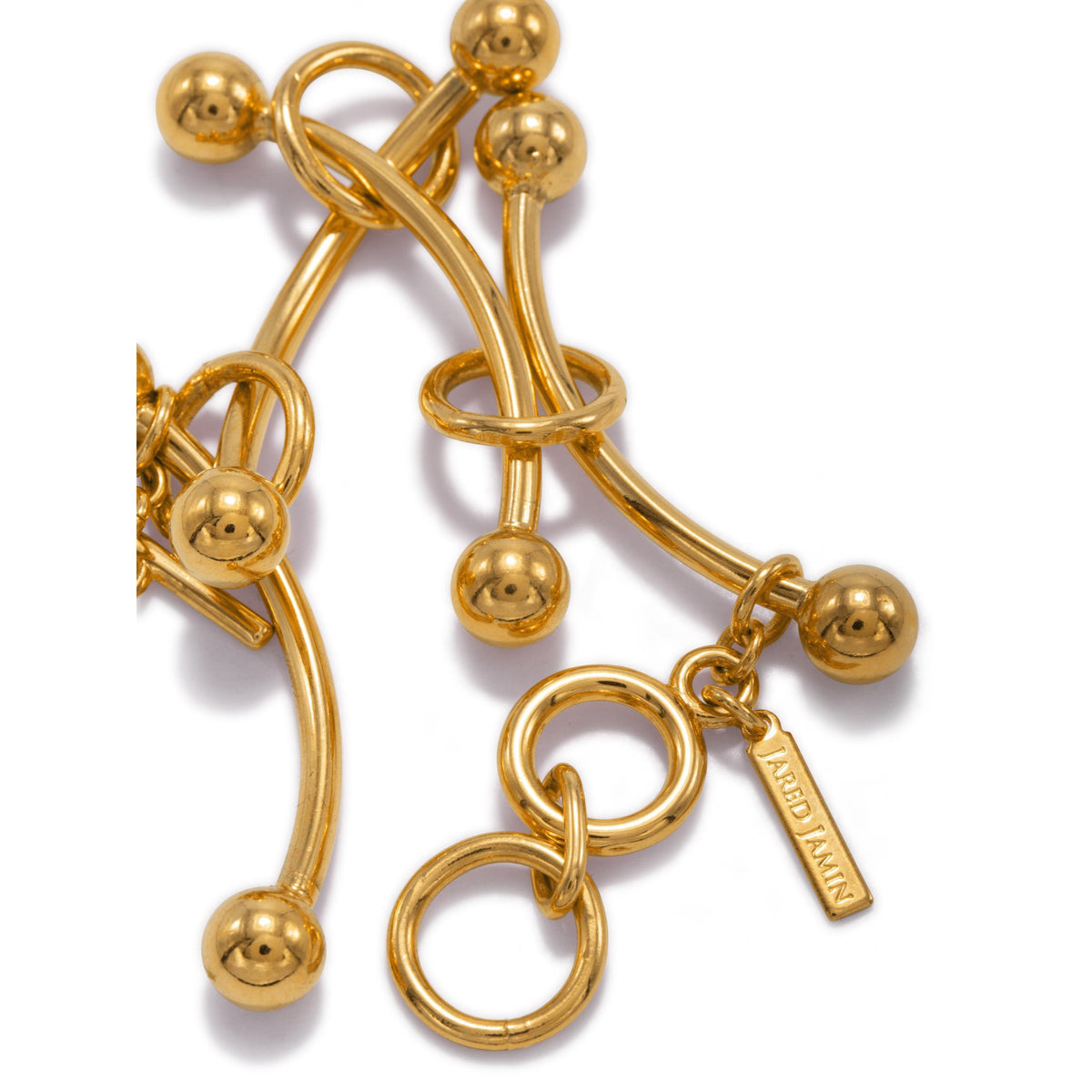 The Gold Smaller Orbita Nova Bracelet by JAREDJAMIN Jewelry Online features smooth, curved gold-toned rods, round ball ends, circular loops, an 18K gold plate finish, a toggle clasp, and a small “ARIED TAIWAN” charm.