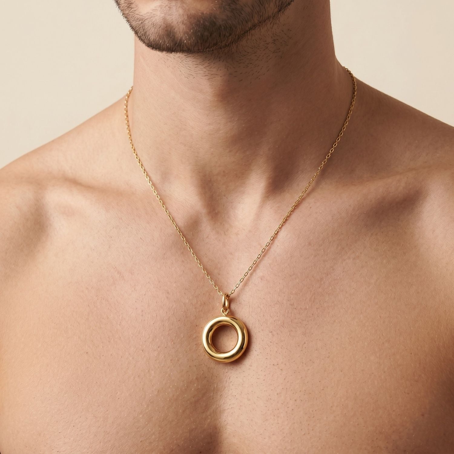 The Gold Smooth Doughnut Necklace Pendant Charm by JAREDJAMIN Jewelry Online features an 18K gold plated, polished circular design with a hollow center, displayed against a white background and suspended from a simple loop bail.