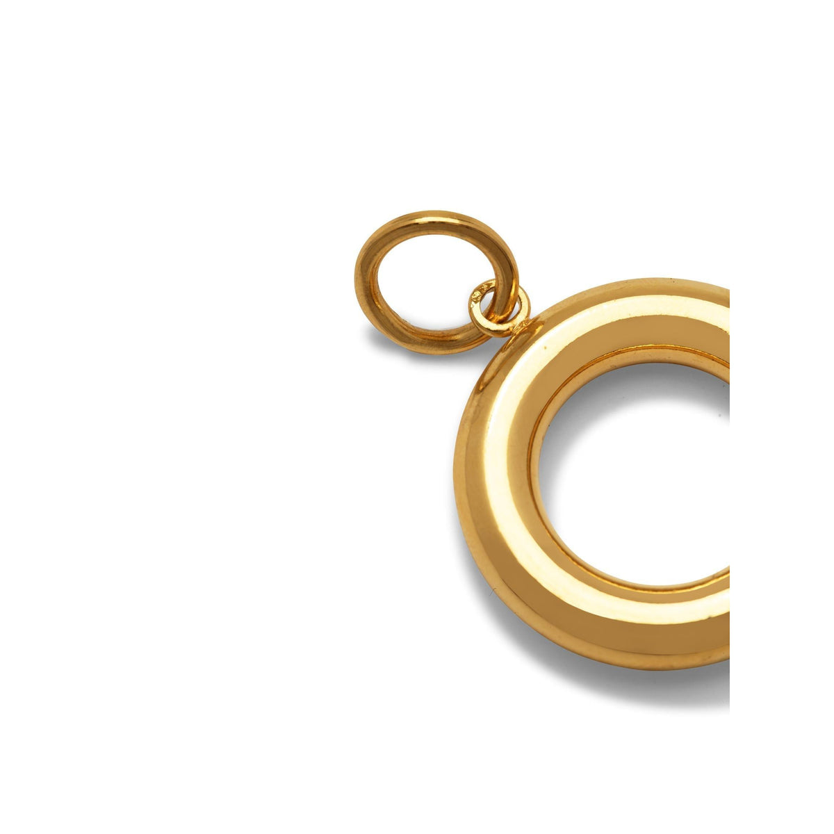 Close-up of the JAREDJAMIN Jewelry Online Gold Smooth Doughnut Necklace Pendant Charm, featuring an 18K gold-plated finish and smooth surface. The charm is partially visible on a white background, attached to a small gold jump ring.
