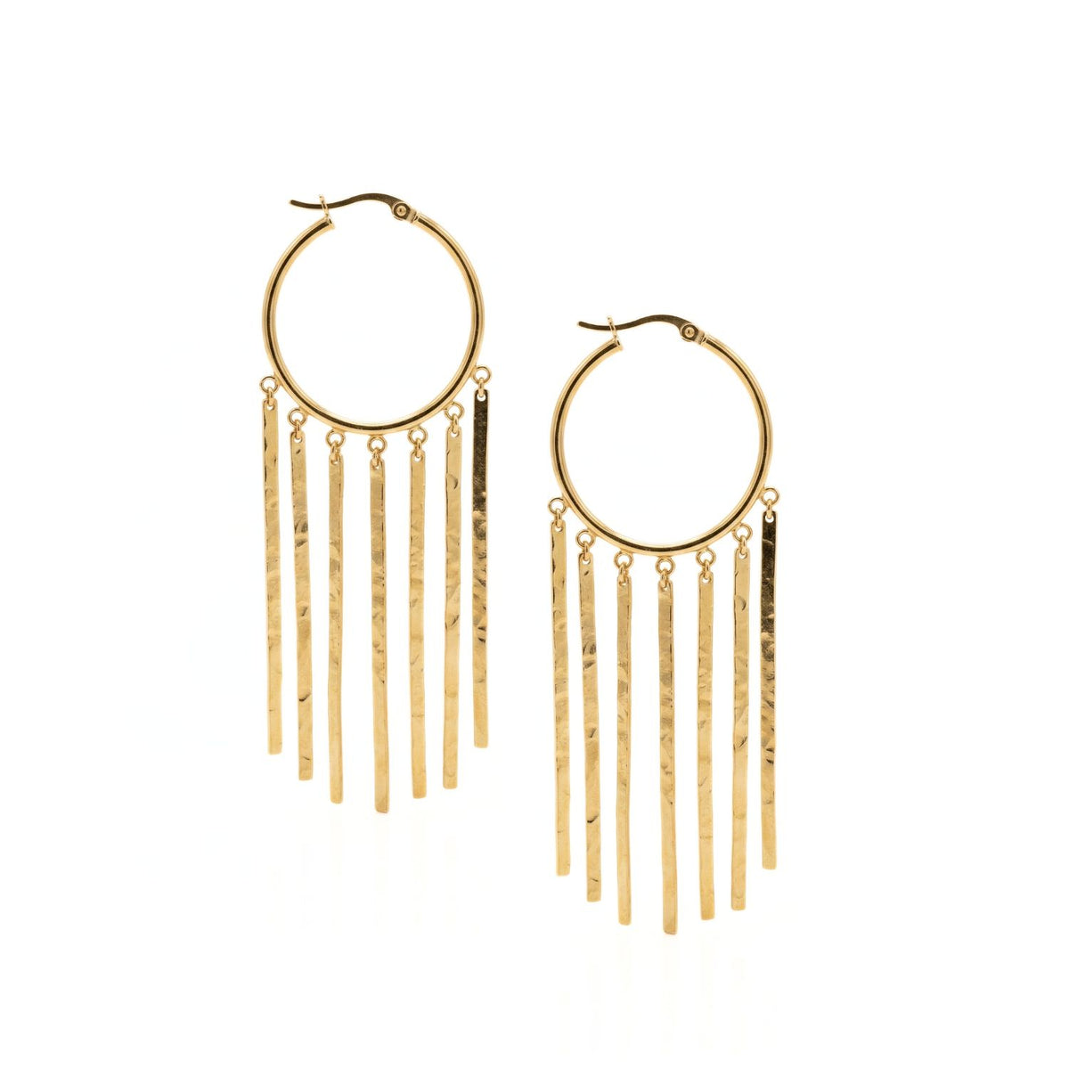 Hand-assembled in our West Hollywood studio, the Gold Wind Catcher Earrings sculpt textured gold hoops with hammered fringe bars, punctuated by leverback clasps. Crafted in small batches with eco-conscious intent. Style Note: slices through tees or silk alike.