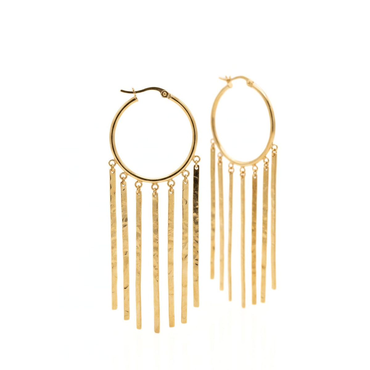 Hand-assembled in our West Hollywood studio, these 18k gold-plated earrings refract light with slender, textured fringe bars. Crafted in small, eco-conscious batches. Style Note: punctuates everything from tailored suiting to silk slip dresses. Shown on white.