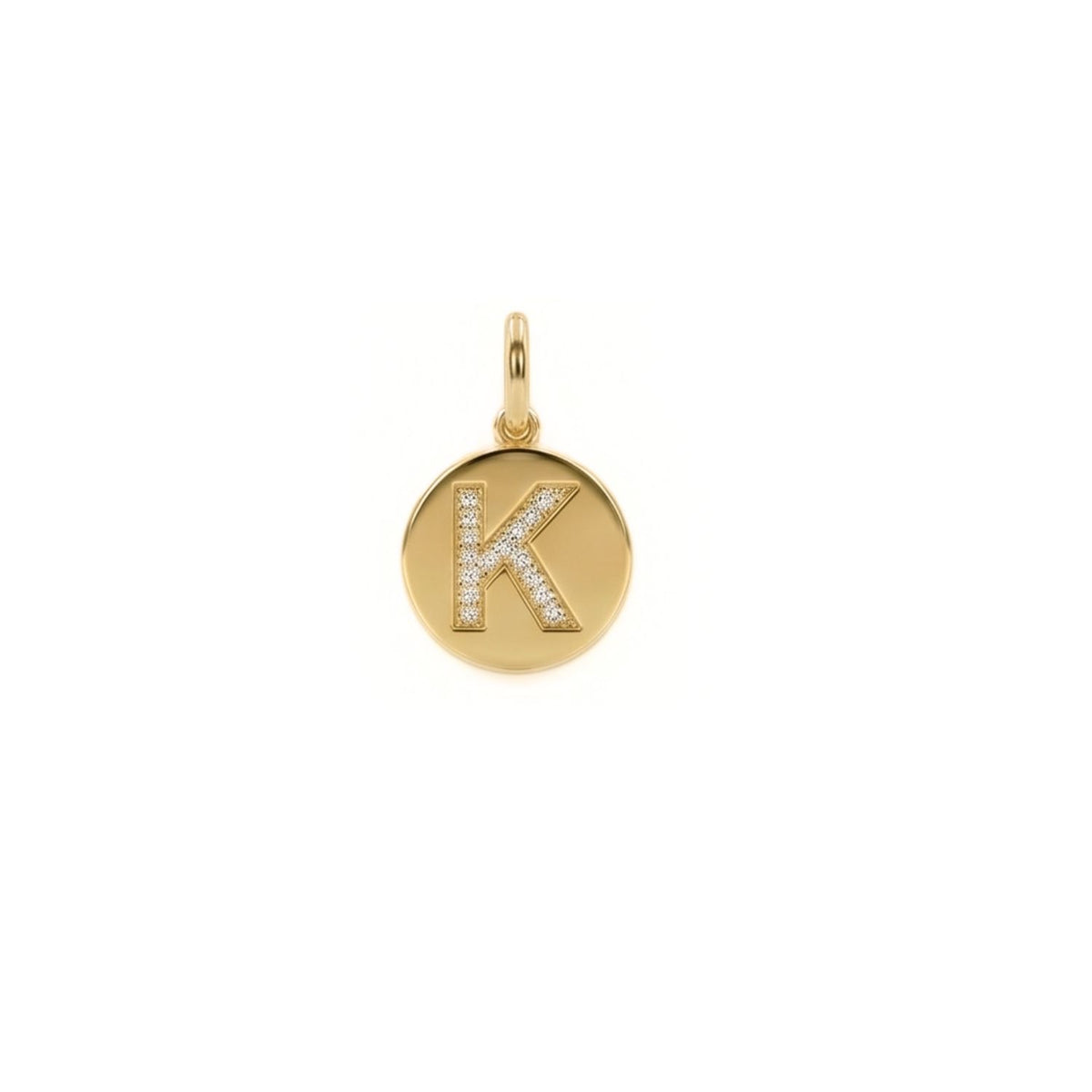 Hand-assembled in our West Hollywood studio, this round pendant sculpts recycled gold into a luminous disc, punctuated by a “K” traced in cubic zirconia. Limited-batch. Style Note: slips from crisp shirting to silk slip dresses with quiet conviction.