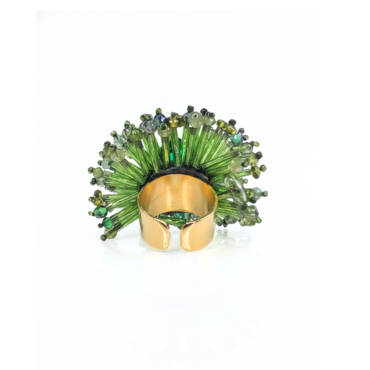 Angled studio layflat shot focusing on the back of the JAREDJAMIN Ivy Green Beaded Burst Ring resting on a white surface, showcasing the gold-toned open shank base that allows for a custom, adjustable fit.